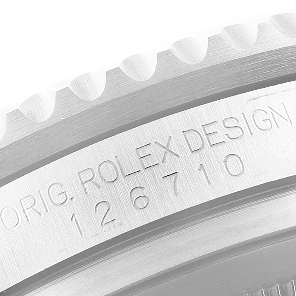 Close-up of the side bezel and engravings on a Rolex GMT-Master 126710 Men
s Stainless Steel Black Dial 126710 Men
s Stainless Steel Black Dial model watch, displaying "ORIG. ROLEX DESIGN 126710".