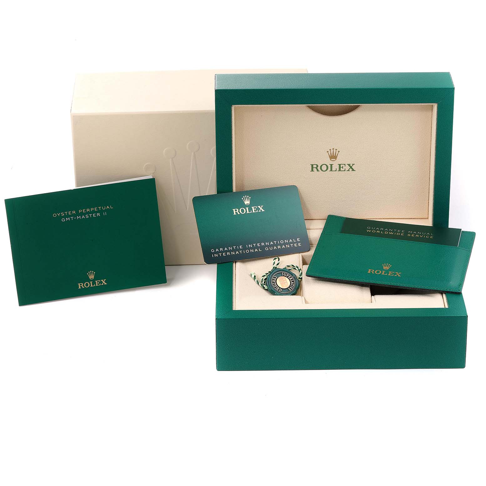 This image shows the open packaging of a Rolex GMT-Master 126710 Men
s Stainless Steel Black Dial 126710 Men
s Stainless Steel Black Dial model, including manuals, guarantee card, and the watch tag.