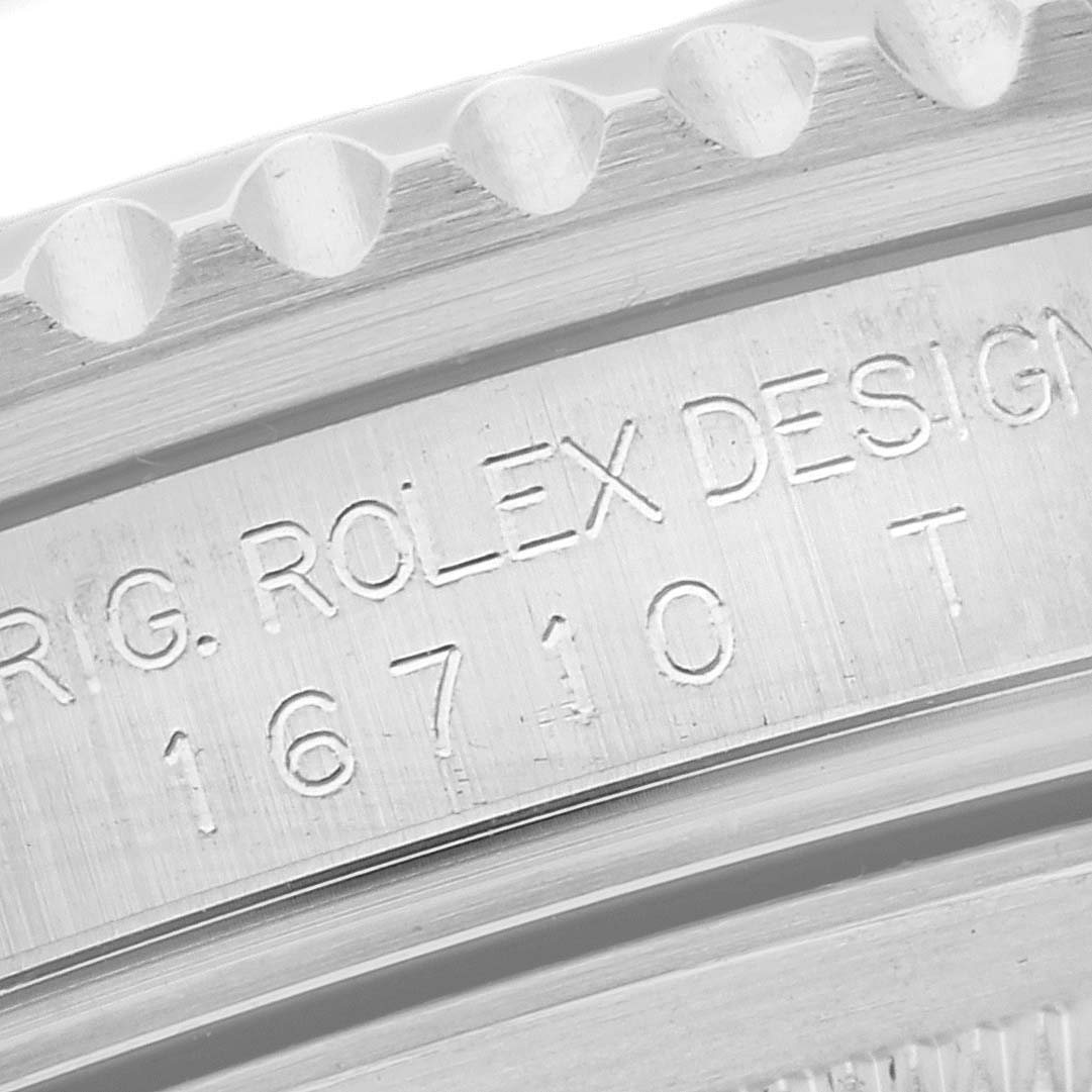 This close-up image shows the engraved case back of a Rolex GMT-Master 16710 Men's Stainless Steel Black Dial 16710 Men's Stainless Steel Black Dial model, highlighting the model number "16710 T."