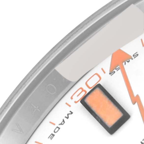 The image shows a close-up of the dial and bezel edge on a Rolex Milgauss 116400 Men's Stainless Steel White Dial 116400 Men's Stainless Steel White Dial watch, highlighting the "30" minute marker and an orange lightning bolt second hand.