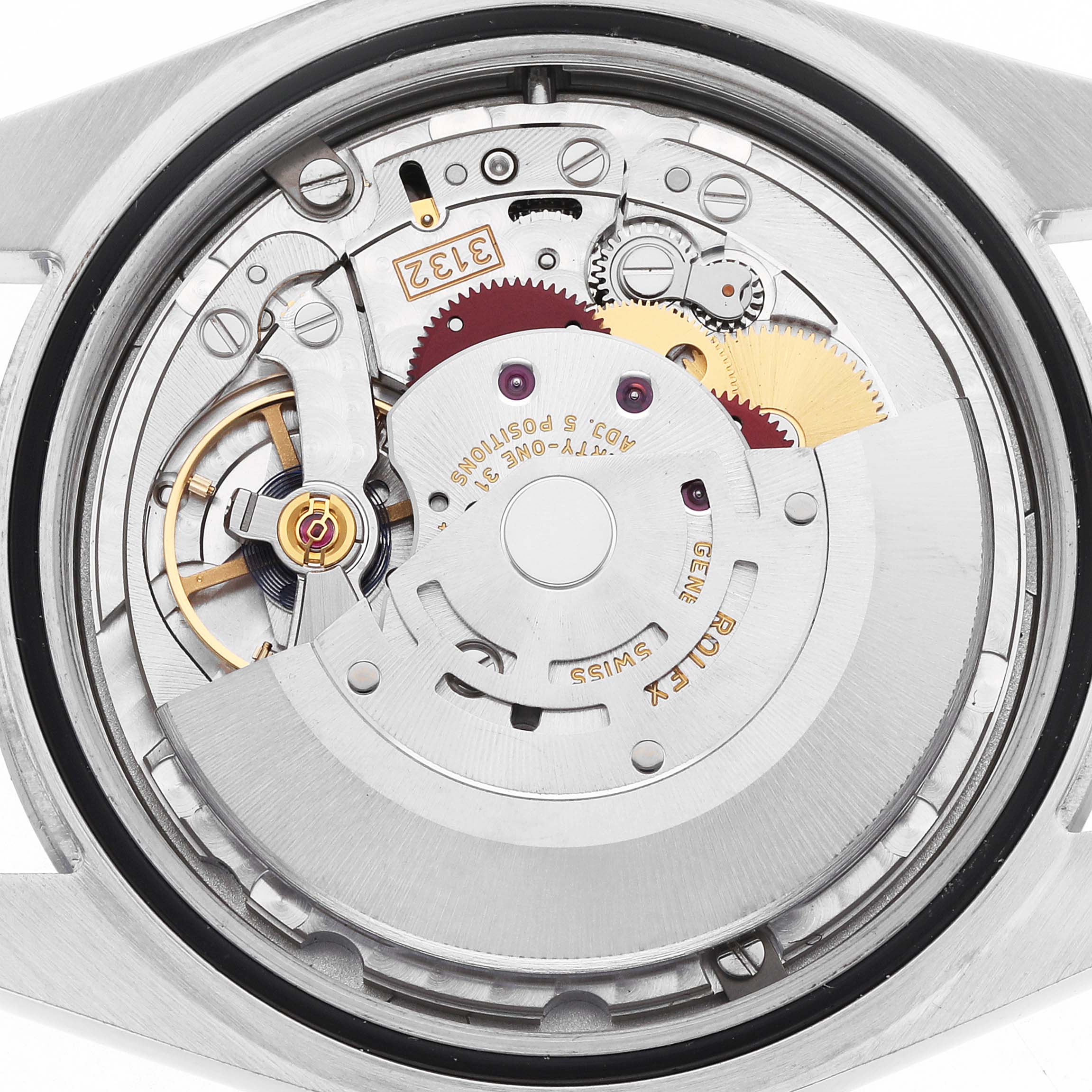 The image shows the internal movement of a Rolex Oyster Perpetual 114300 Men's Stainless Steel Grey Dial watch from a top-down angle, displaying gears and mechanical components.