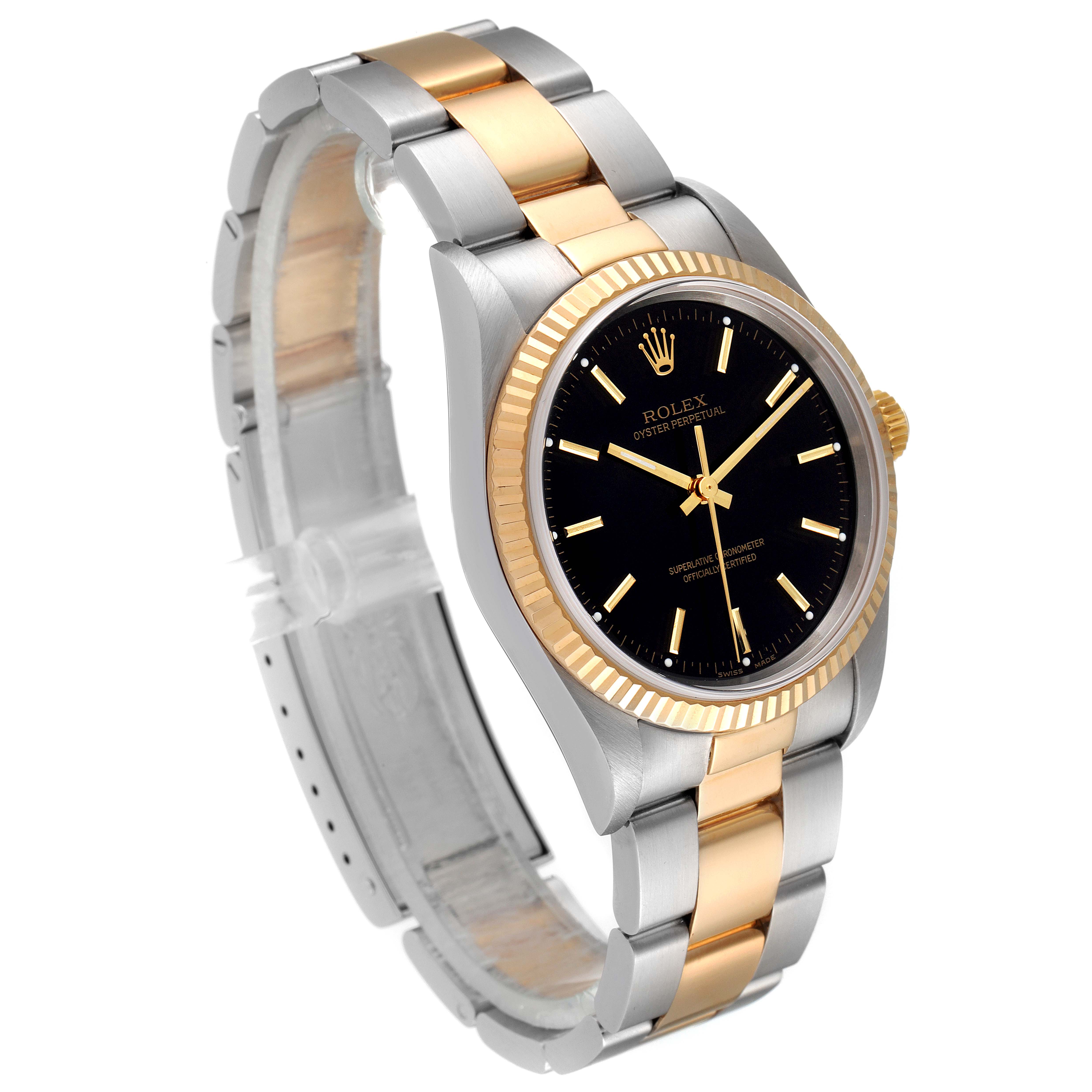 The image shows a side angle of a Rolex Oyster Perpetual 14233 Men's Steel and Gold (two tone) Black Dial 14233 Men's Steel and Gold (two tone) Black Dial watch, detailing its black dial, gold bezel, and bi-metallic bracelet.