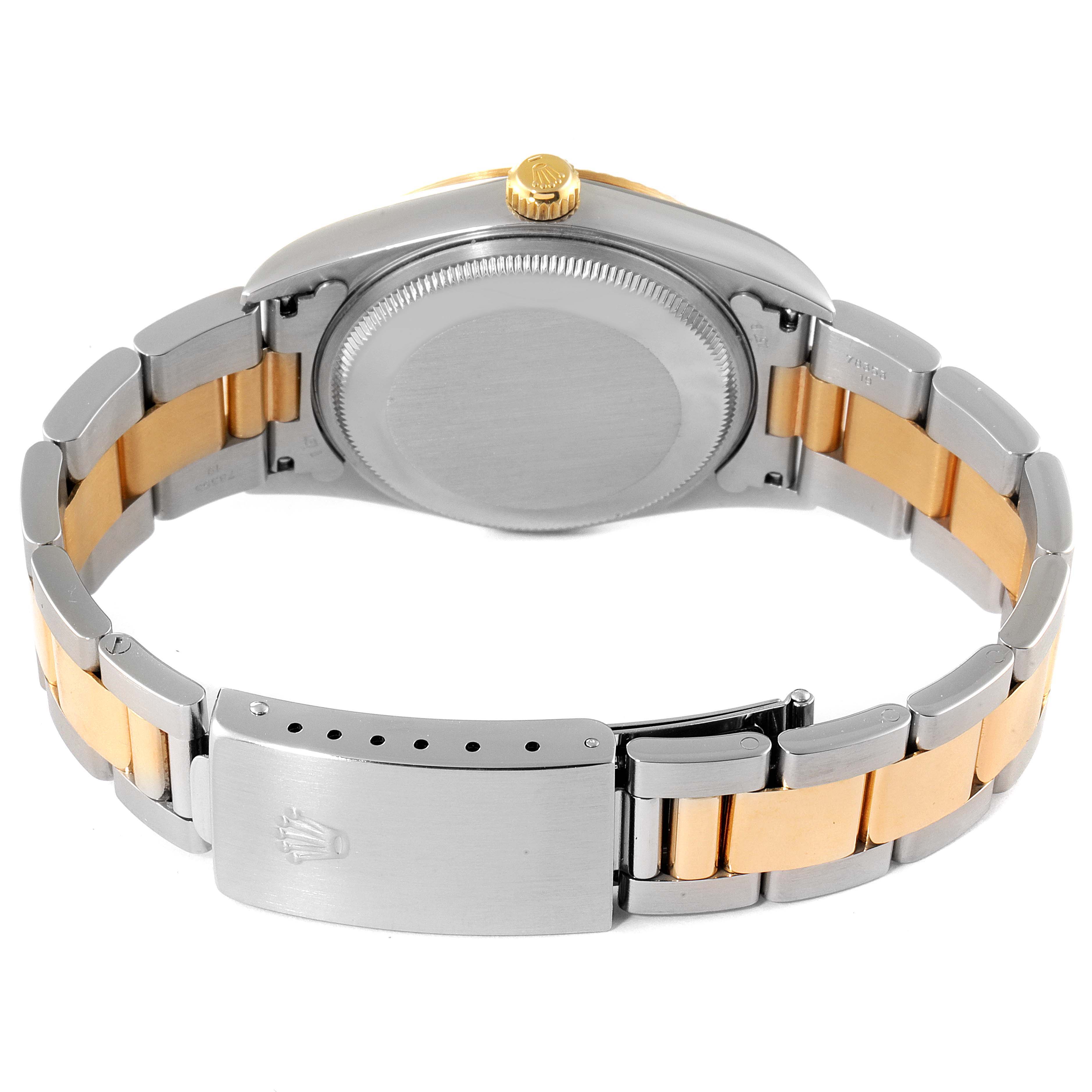 The image shows the back of a Rolex Oyster Perpetual 14233 Men's Steel and Gold (two tone) Black Dial 14233 Men's Steel and Gold (two tone) Black Dial watch, highlighting the case back, crown, and two-tone bracelet with the clasp.