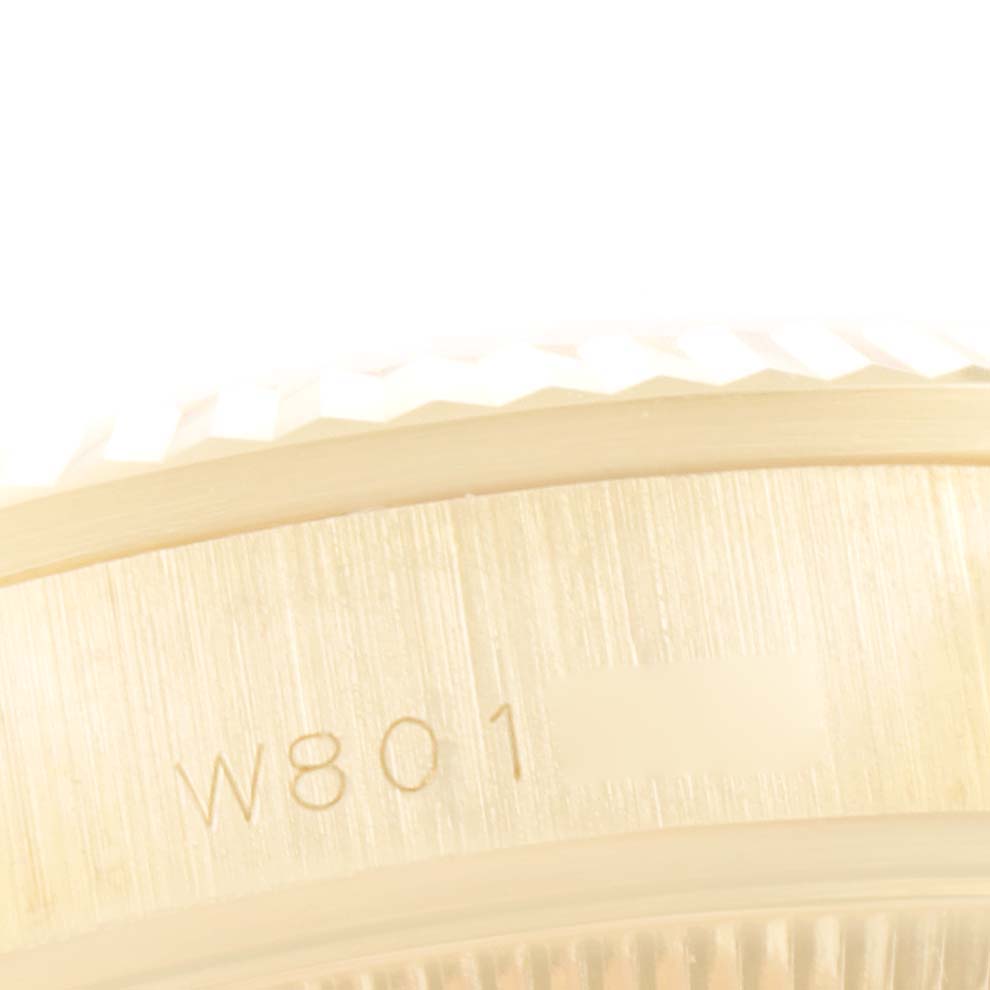 This image is a close-up of the serial number engraved on the side of a Rolex President 68278 Women's Yellow Gold Champagne Dial 68278 Women's Yellow Gold Champagne Dial watch.