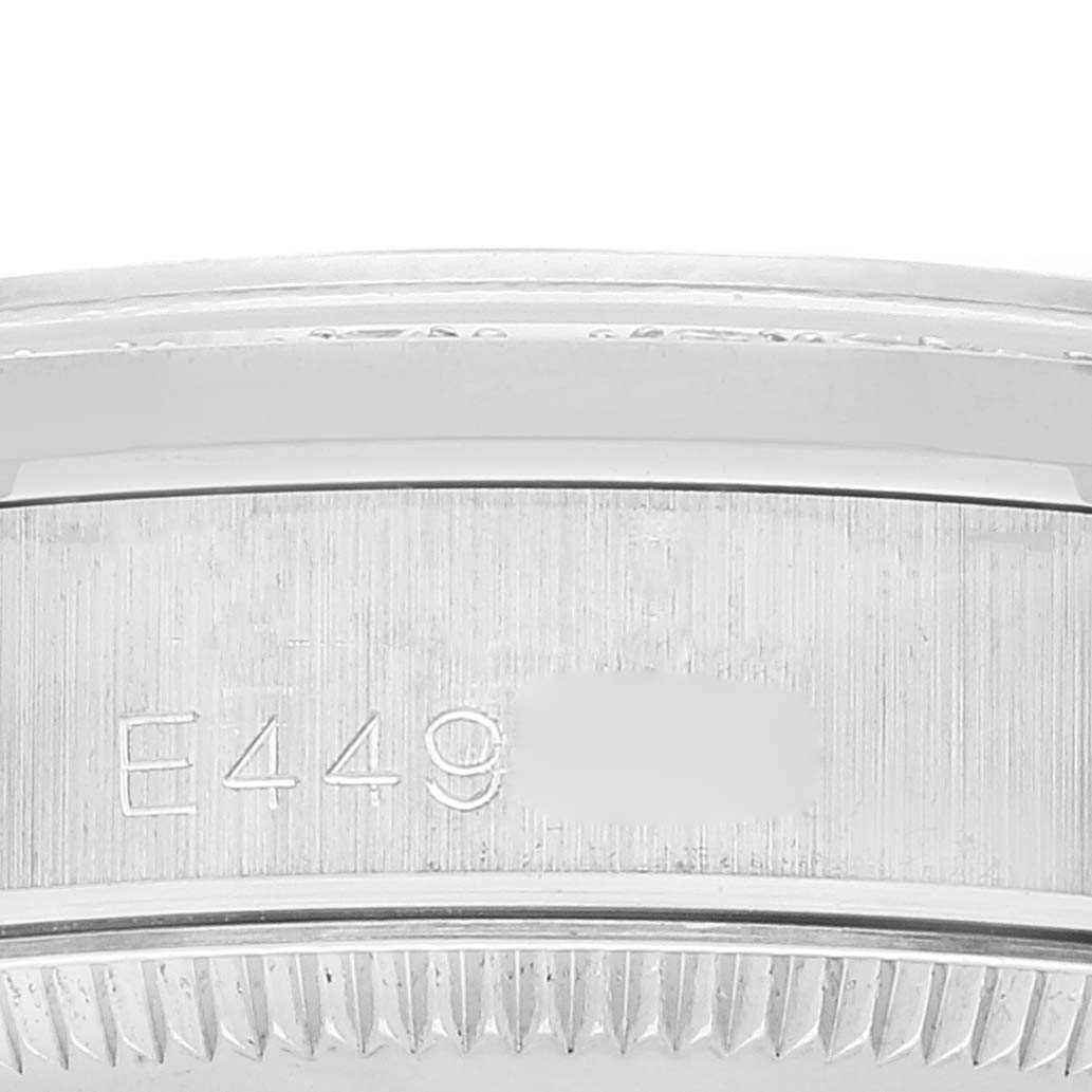 This close-up image shows the serial number engraving and part of the bezel's edge on a Rolex President 68159 Women's White Gold Silver Dial 68159 Women's White Gold Silver Dial model watch.