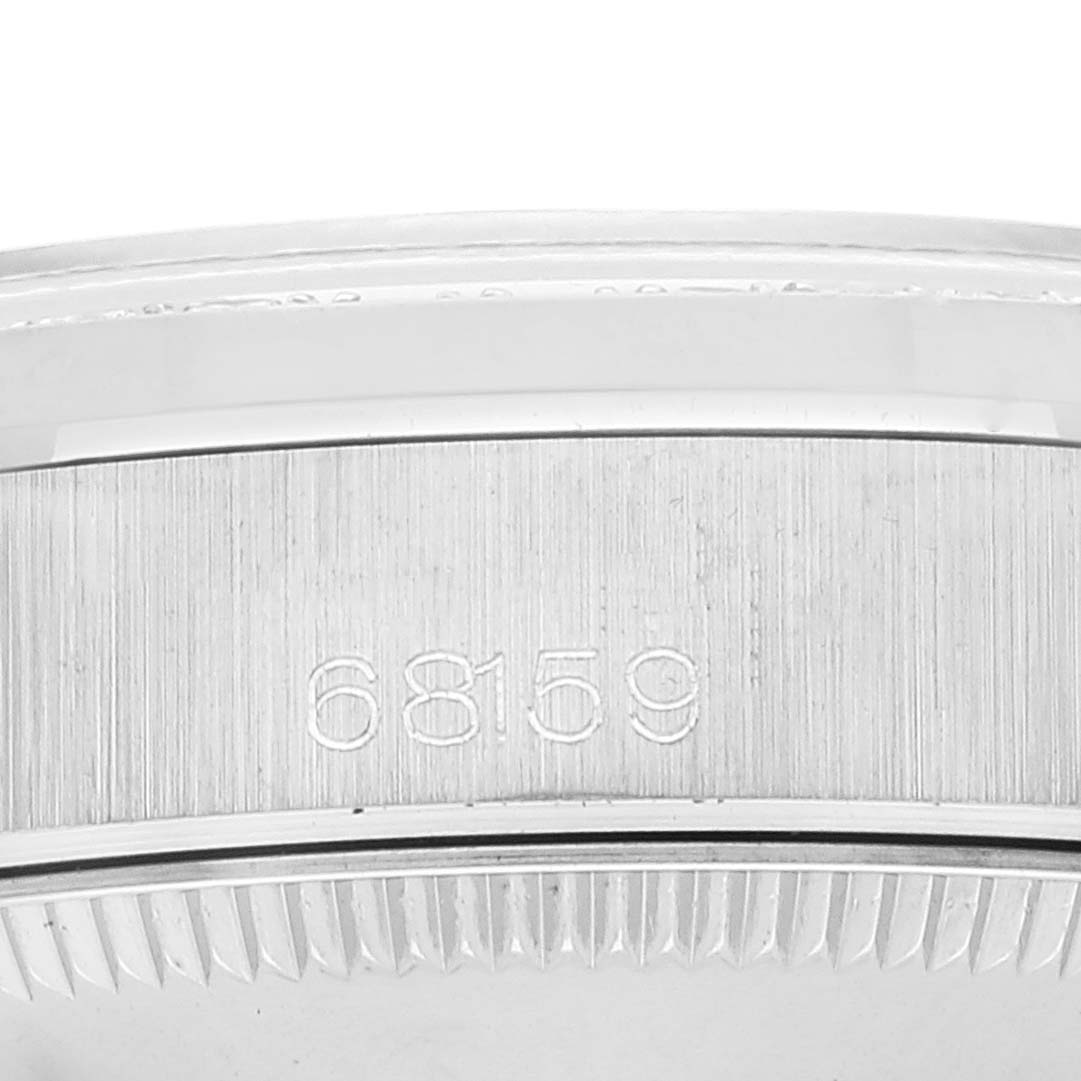 The image shows a close-up of the case-back serial number of a Rolex President 68159 Women's White Gold Silver Dial 68159 Women's White Gold Silver Dial model watch.