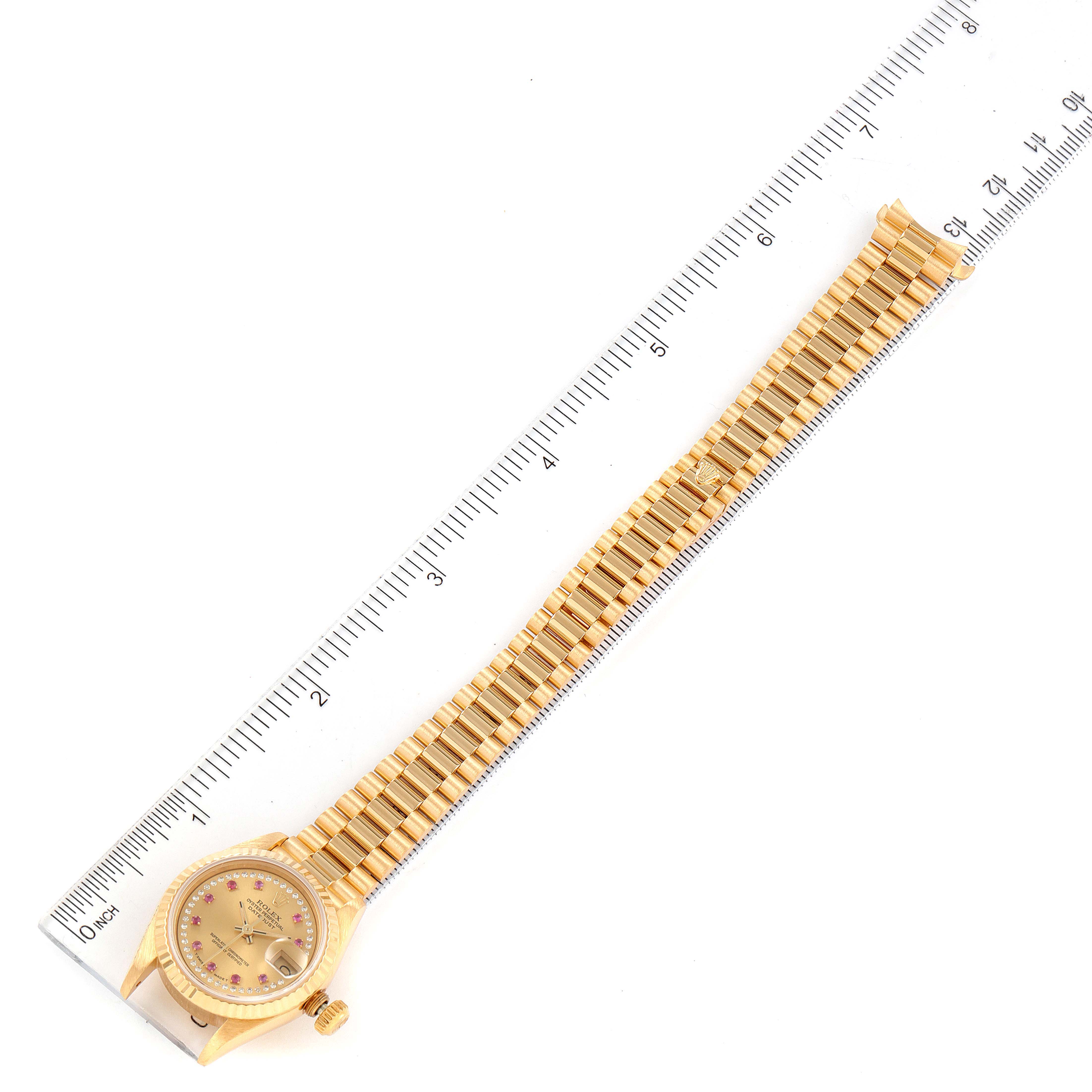 The image shows a Rolex President 69178 Women's Yellow Gold Champagne Dial 69178 Women's Yellow Gold Champagne Dial model watch laid flat with a ruler beside it for scale.