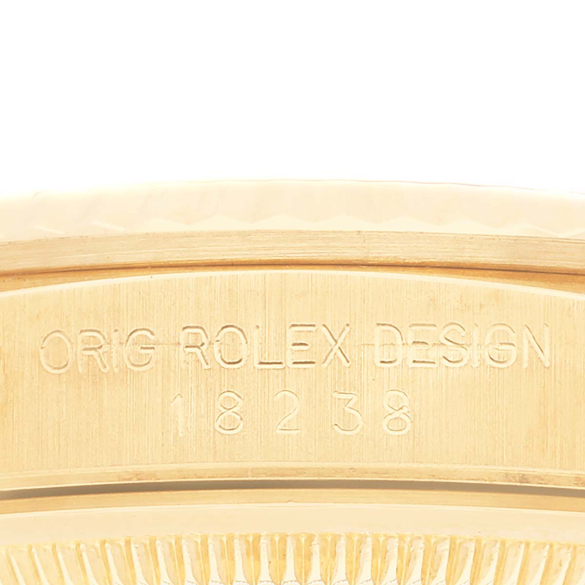 The image shows the engraved side of a Rolex President 18238 Men's Yellow Gold Champagne Dial 18238 Men's Yellow Gold Champagne Dial model 18238, featuring the text "ORIG ROLEX DESIGN."