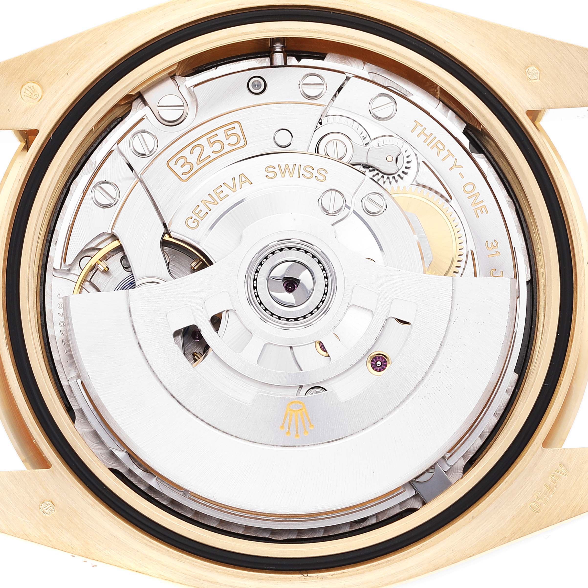 This image shows the intricate movement and internal mechanics of a Rolex President 228238 Men's Yellow Gold Black Dial 228238 Men's Yellow Gold Black Dial model watch from a top-down angle.