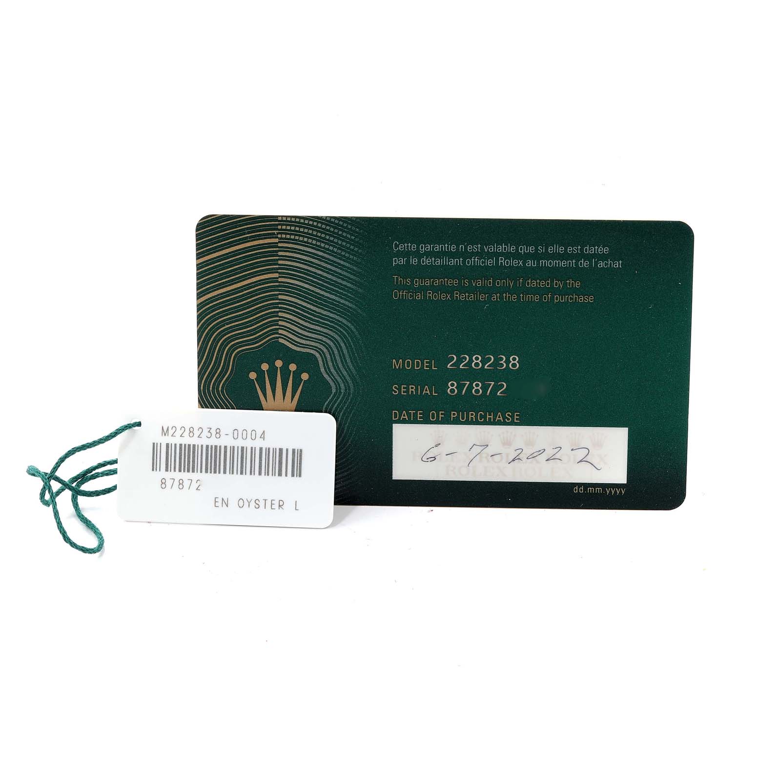 The image shows the warranty card and tag for a Rolex President 228238 Men's Yellow Gold Black Dial 228238 Men's Yellow Gold Black Dial model 228238 watch.