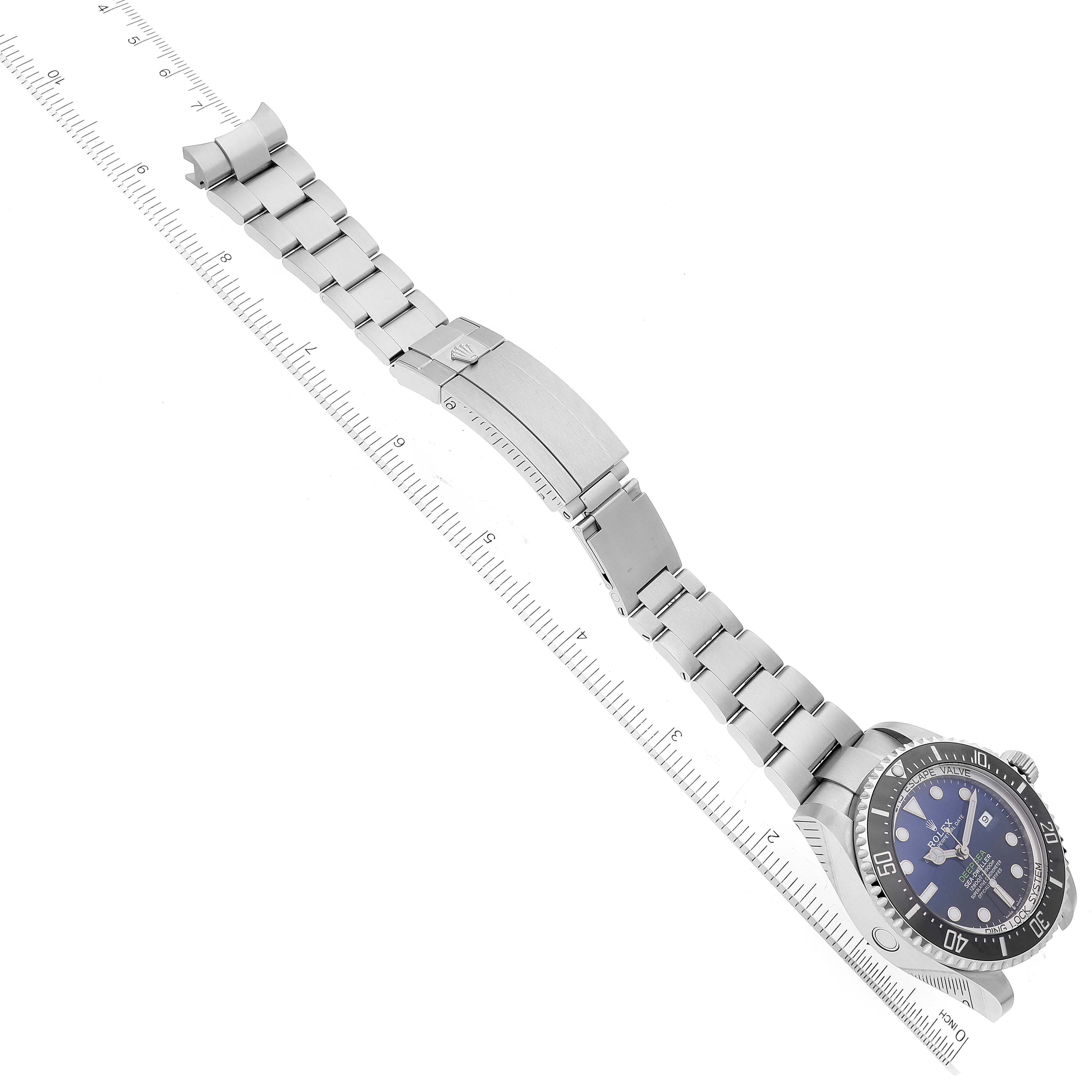 The Rolex Sea-Dweller 126660 Men's Stainless Steel Blue Dial 126660 Men's Stainless Steel Blue Dial watch is shown at a top angle, displaying its face, bezel, and metal bracelet with a clasp.