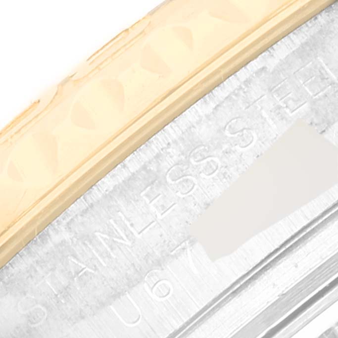 This close-up image shows the case edge of a Rolex Yacht-Master 69623 Women's Steel and Gold (two tone) Grey Dial 69623 Women's Steel and Gold (two tone) Grey Dial watch, featuring stainless steel and gold details.