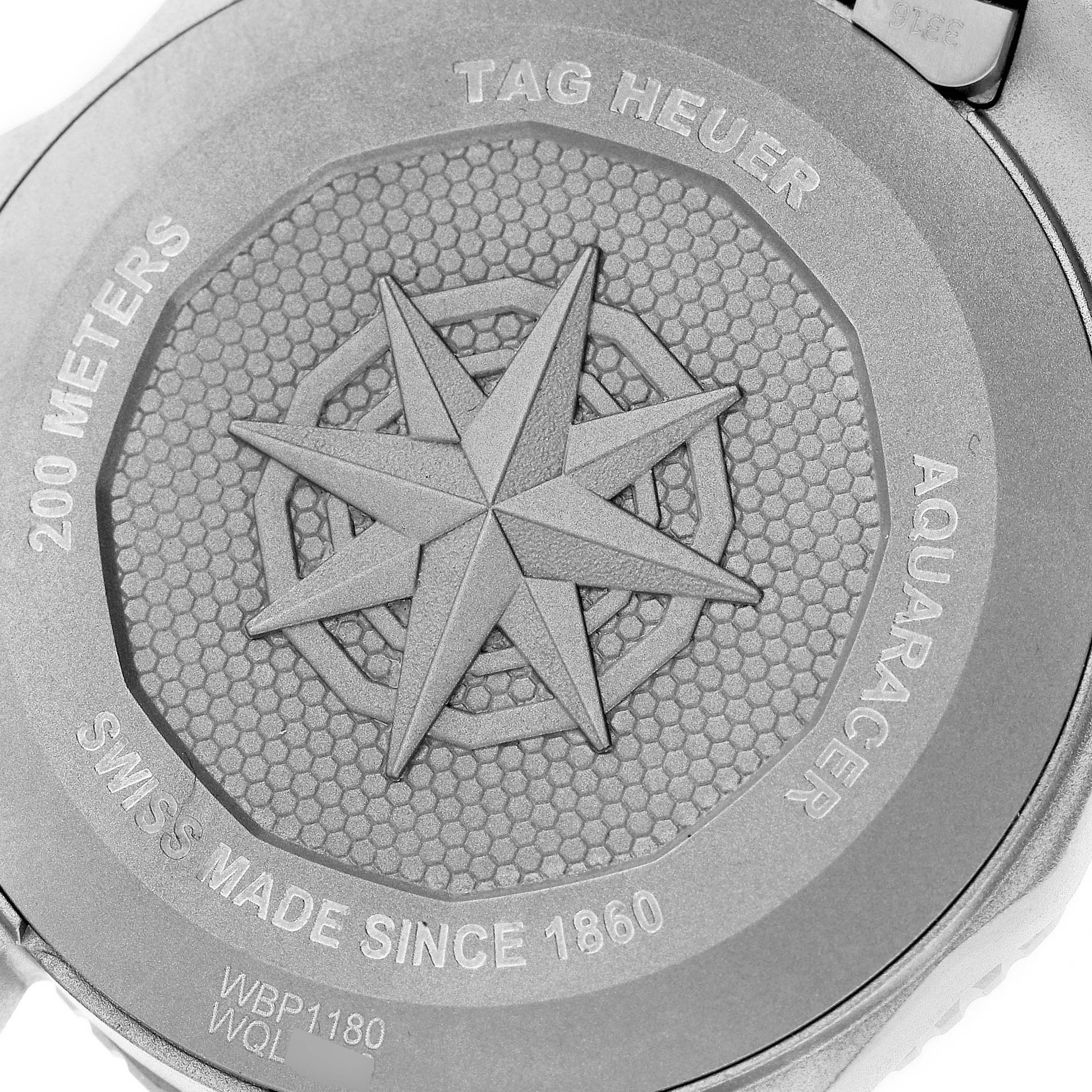 The image shows the back case of a Tag Heuer Aquaracer WBP1180.BF0000 Men's Titanium Black Dial WBP1180.BF0000 Men's Titanium Black Dial watch, focused on its engraved details and logos.