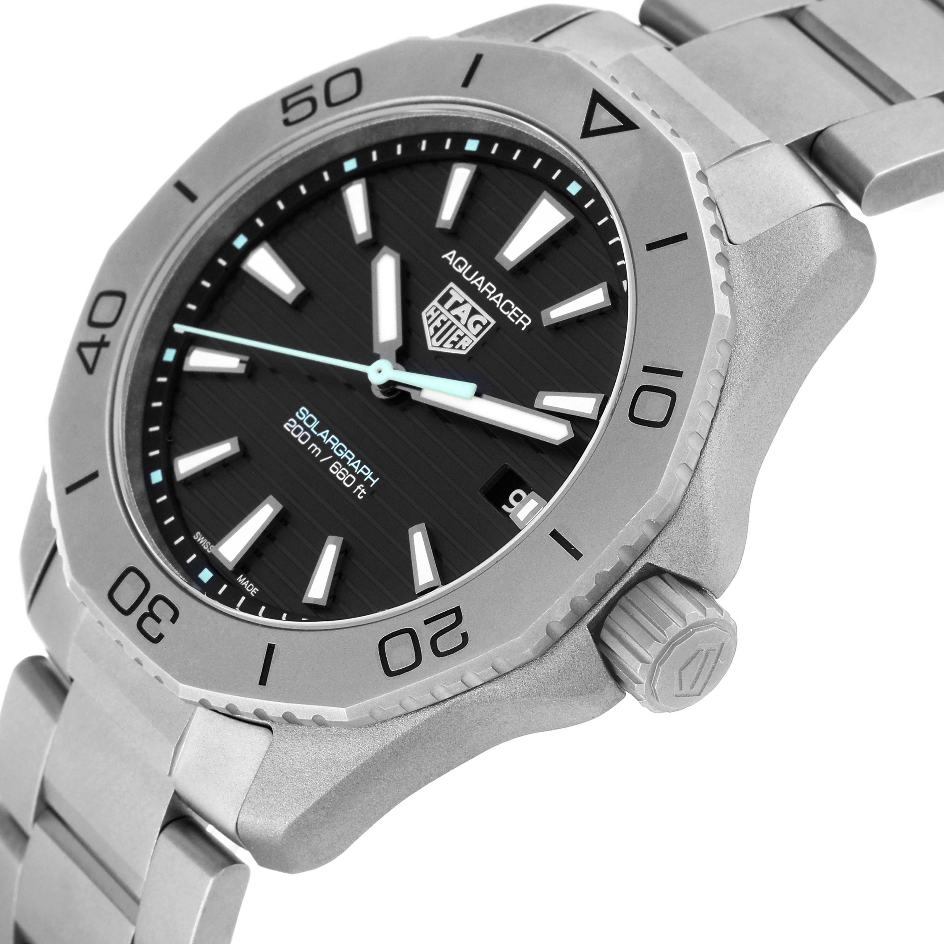 The Tag Heuer Aquaracer WBP1180.BF0000 Men's Titanium Black Dial WBP1180.BF0000 Men's Titanium Black Dial watch is shown at an oblique angle, highlighting the bezel, face, crown, and part of the bracelet.