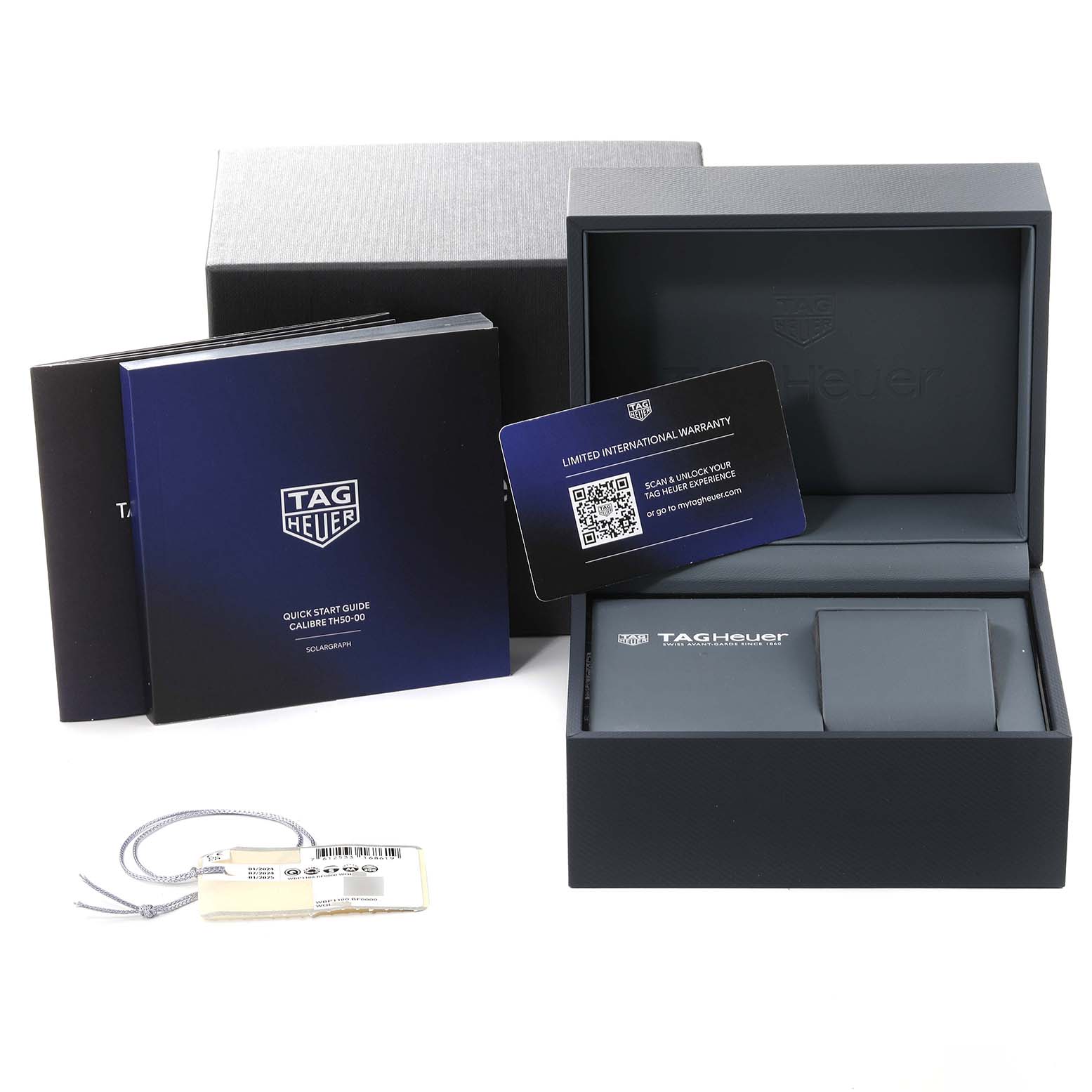 The image shows an open Tag Heuer Aquaracer WBP1180.BF0000 Men's Titanium Black Dial WBP1180.BF0000 Men's Titanium Black Dial watch box, manuals, warranty card, and a tag, taken from a front angle.