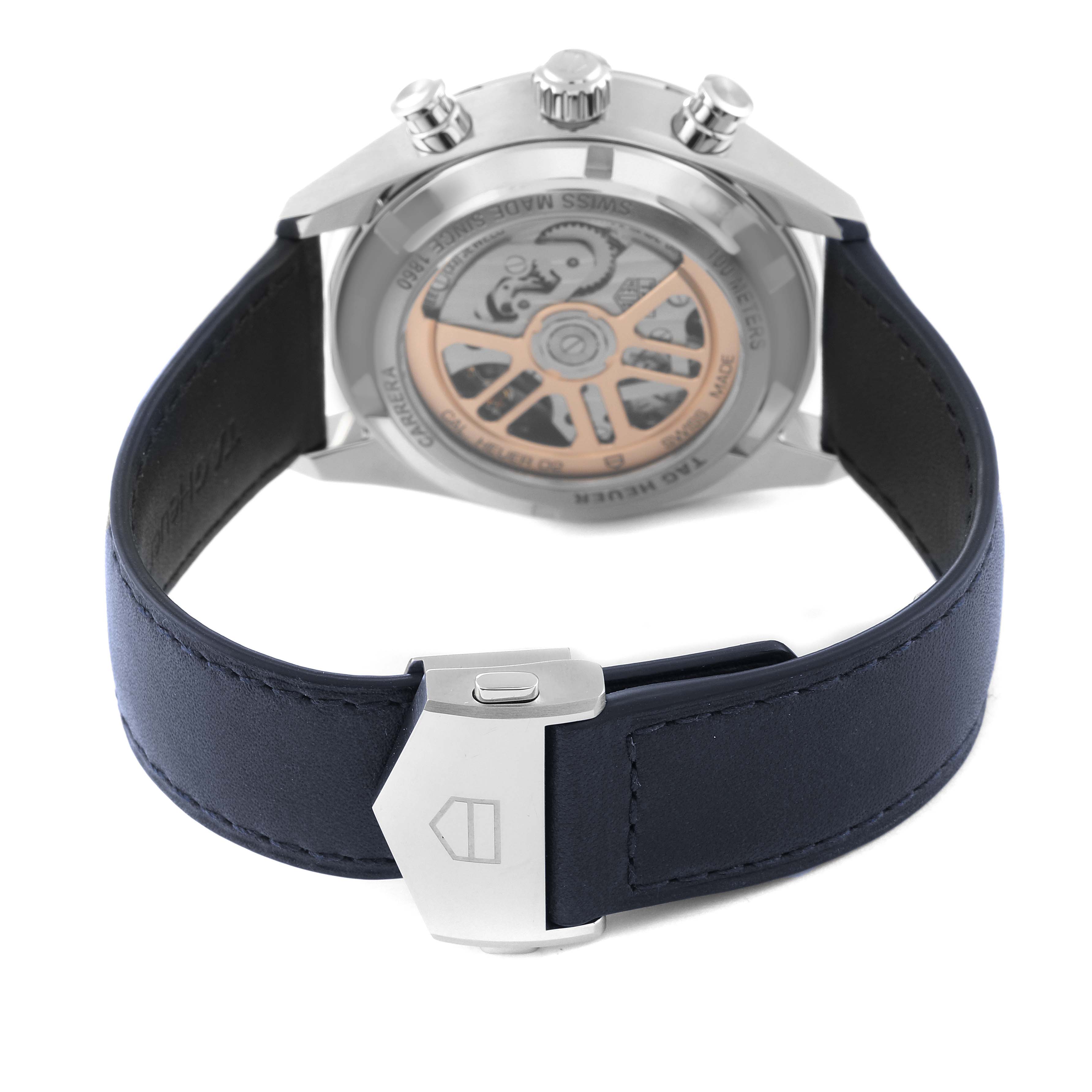 The image shows the back view of the Tag Heuer Carrera CBN201D.FC6543 Men's Stainless Steel Blue Dial CBN201D.FC6543 Men's Stainless Steel Blue Dial watch, highlighting its strap, clasp, and exposed movement.