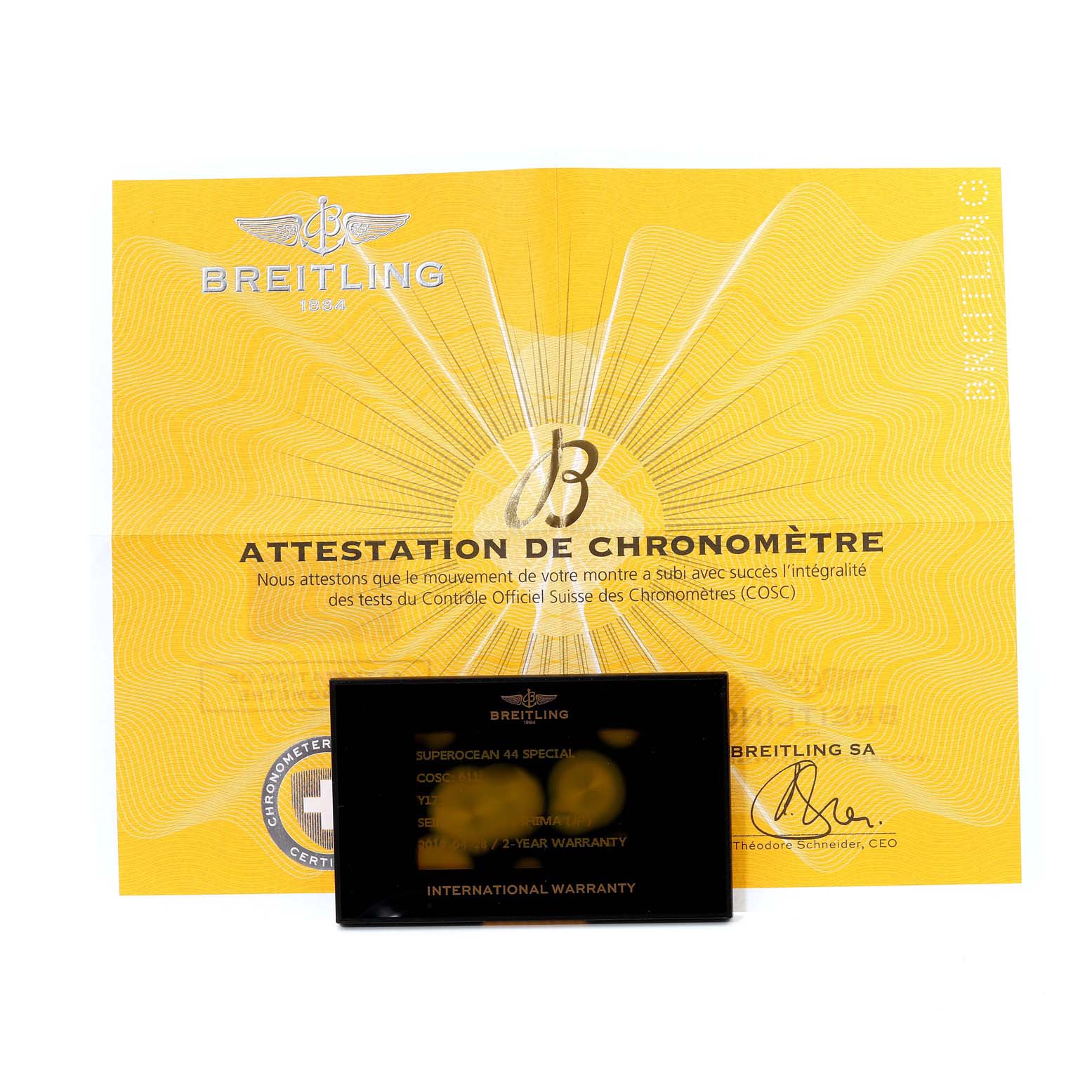 The image shows a Breitling Superocean Y17393 Men's Stainless Steel Blue Dial Y17393 Men's Stainless Steel Blue Dial model's chronometer certificate and international warranty card from a top-down angle.