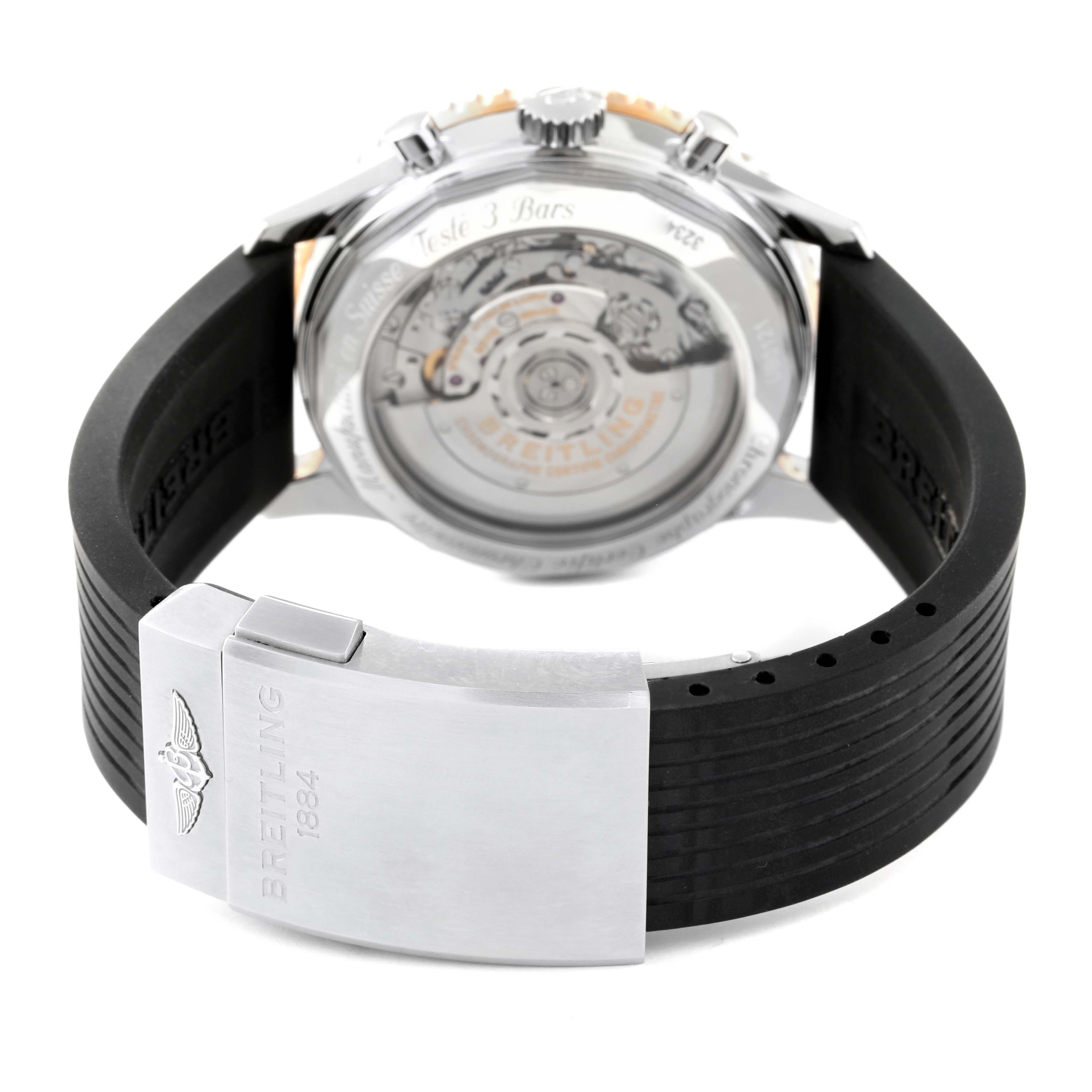 This image shows the back view of a Breitling Navitimer UB012111 Men's Steel and Gold (two tone) Grey Dial UB012111 Men's Steel and Gold (two tone) Grey Dial watch, focusing on the clasp and movement inside the transparent caseback.
