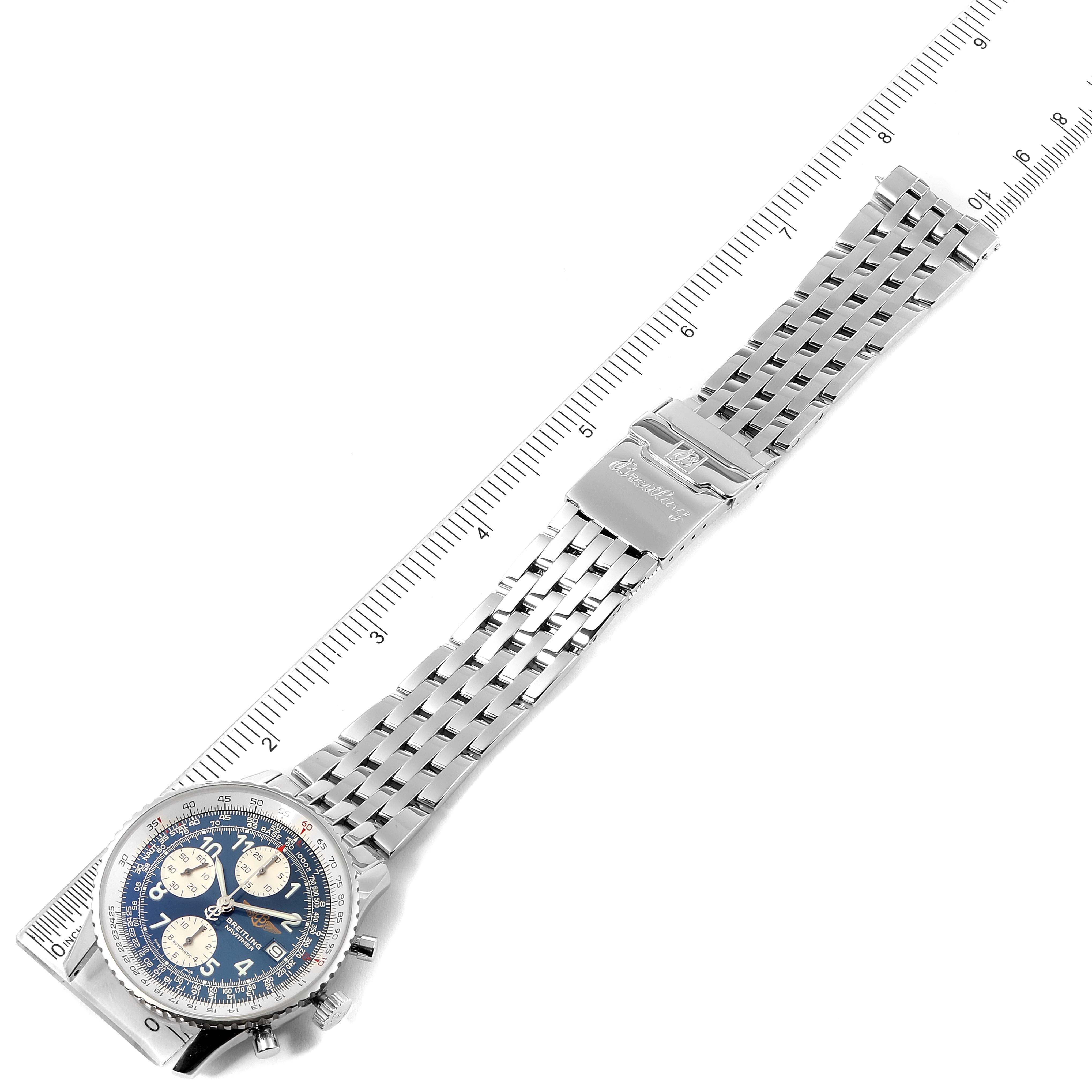 The image shows a Breitling Navitimer A13322 Men's Stainless Steel Blue Dial A13322 Men's Stainless Steel Blue Dial watch laid flat with its face, stainless steel bracelet, and clasp visible alongside a measurement ruler.