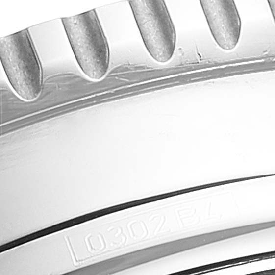 This image shows a close-up of the bezel of the Breitling Navitimer A13322 Men's Stainless Steel Blue Dial A13322 Men's Stainless Steel Blue Dial watch, highlighting its distinctive serrated edge.