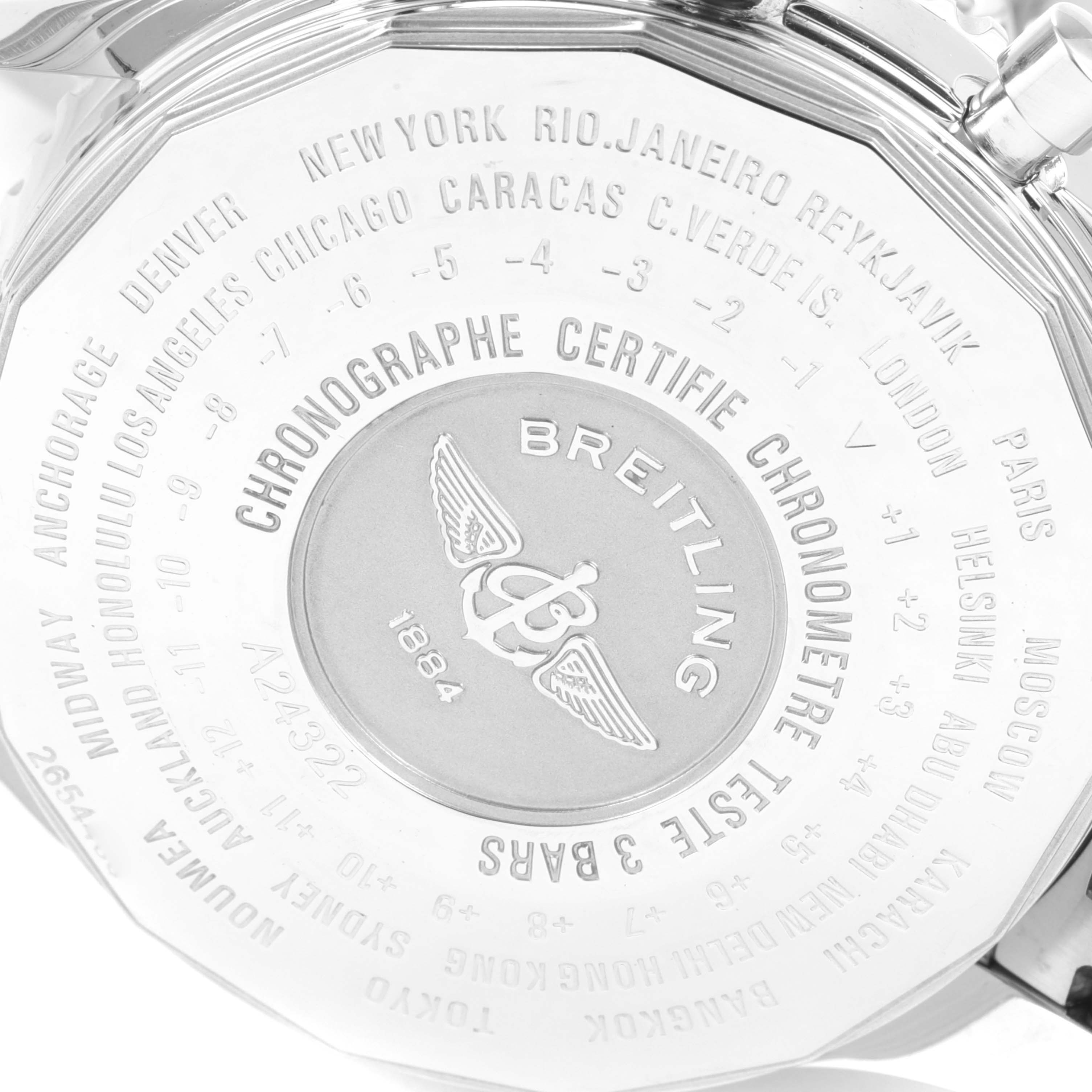 The image shows the back case of a Breitling Navitimer A24322 Men's Stainless Steel Silver Dial A24322 Men's Stainless Steel Silver Dial watch featuring the brand's logo and various cities with time zone information.