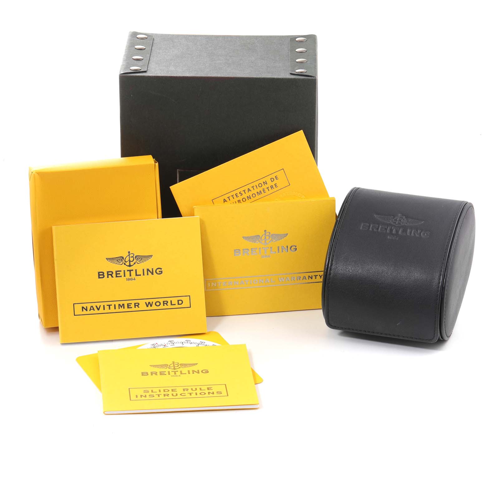 The image shows the packaging and documentation for a Breitling Navitimer A24322 Men's Stainless Steel Silver Dial A24322 Men's Stainless Steel Silver Dial watch, including a box, warranty card, and instruction booklets.