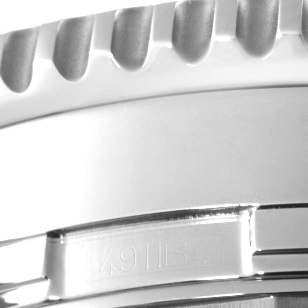 The image shows a close-up side view of the bezel and case of a Breitling Navitimer A24322 Men's Stainless Steel Silver Dial A24322 Men's Stainless Steel Silver Dial watch.