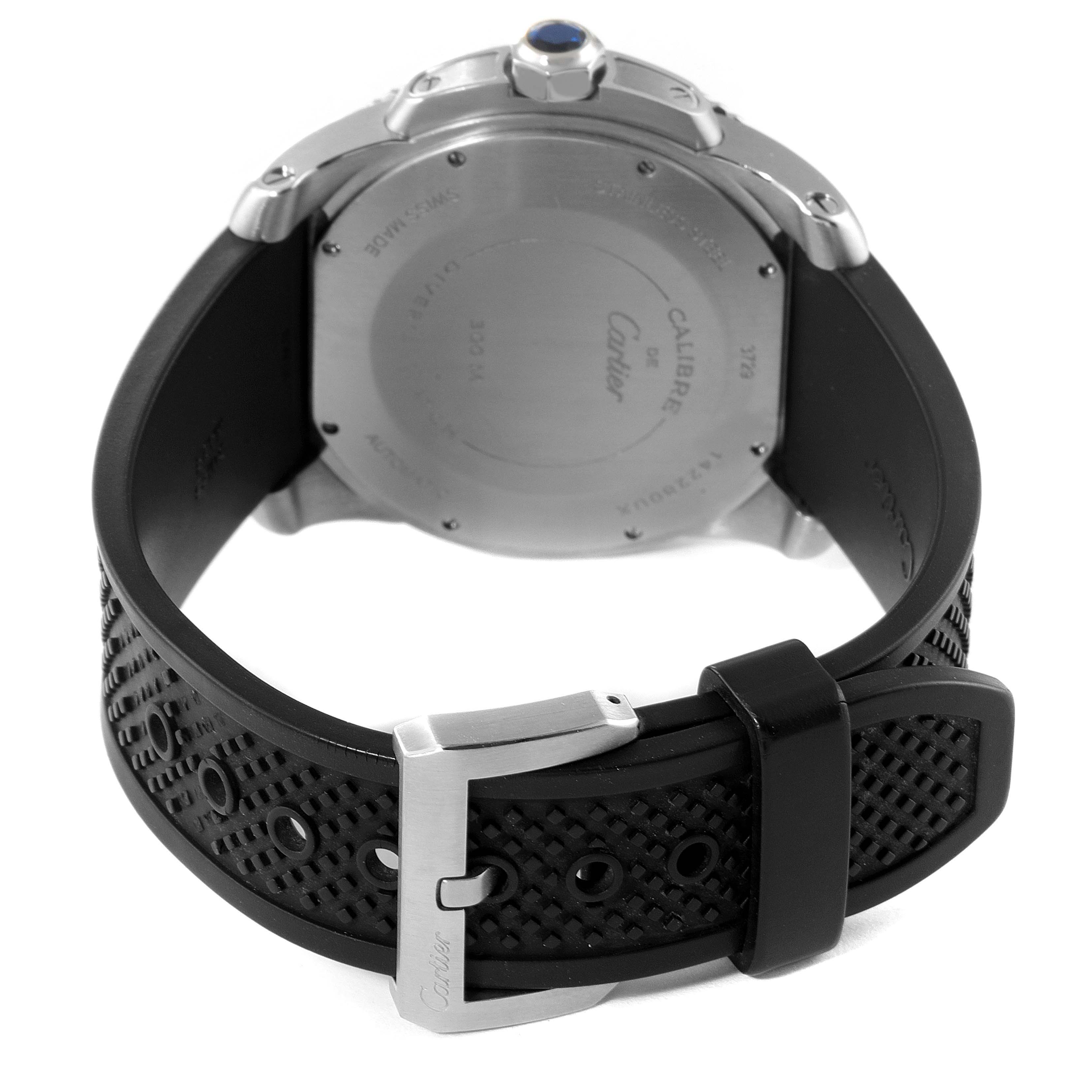 The image shows the back and clasp of a Calibre de Cartier watch by Cartier, including the case back and black textured strap.