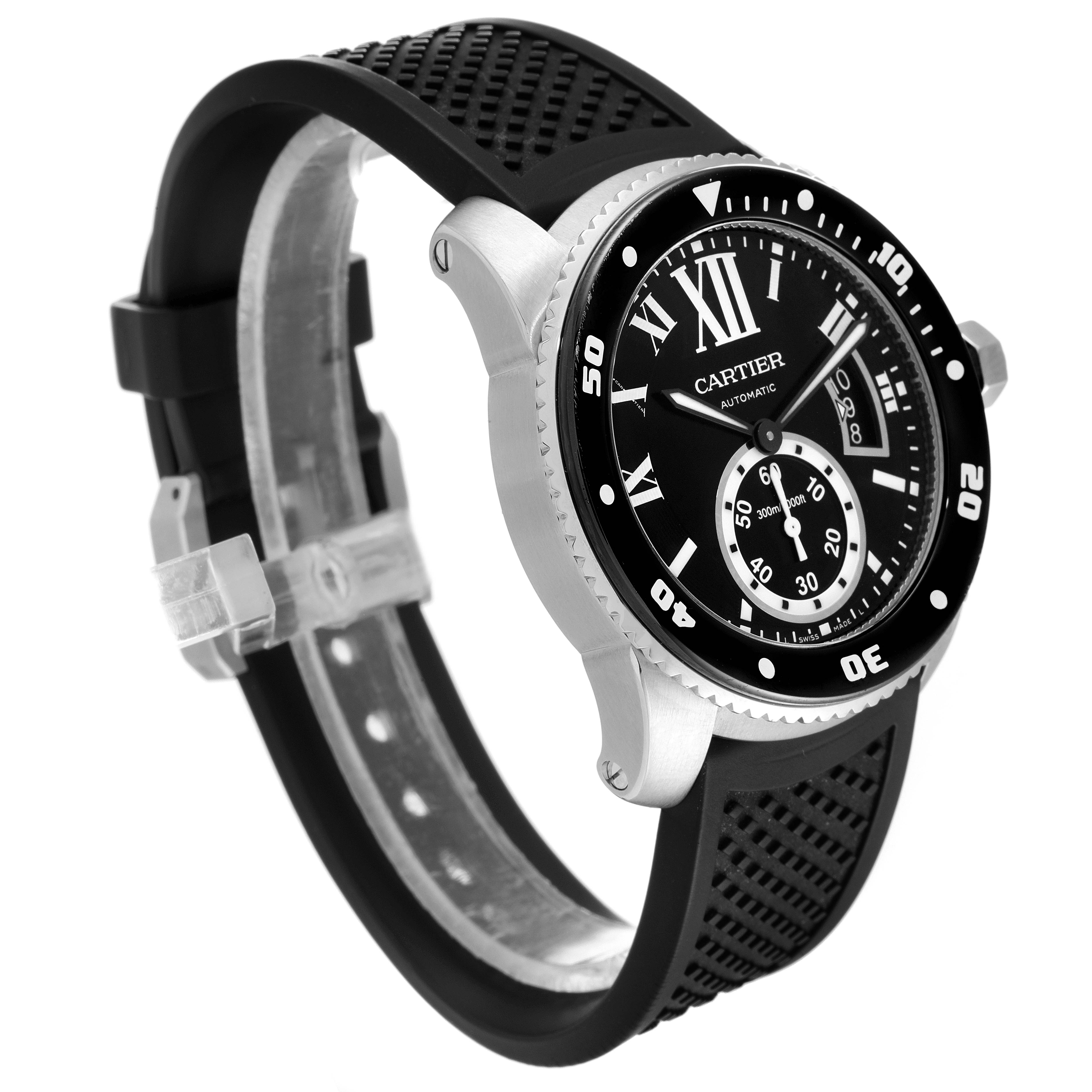 The Calibre de Cartier watch by Cartier is shown at an angle displaying the face, bezel, and black rubber strap.