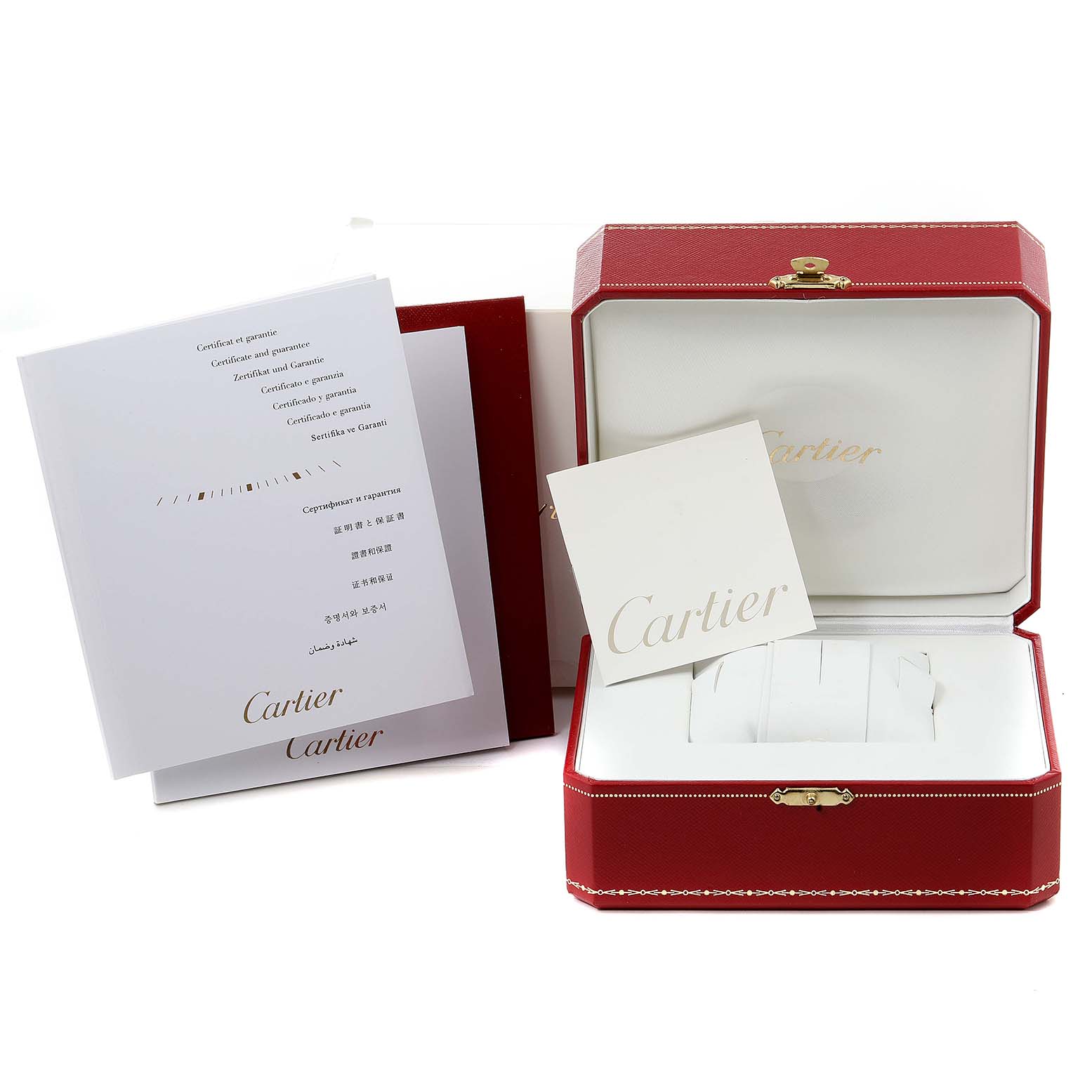 The image shows the packaging, manuals, and empty case for the Calibre de Cartier watch by Cartier.