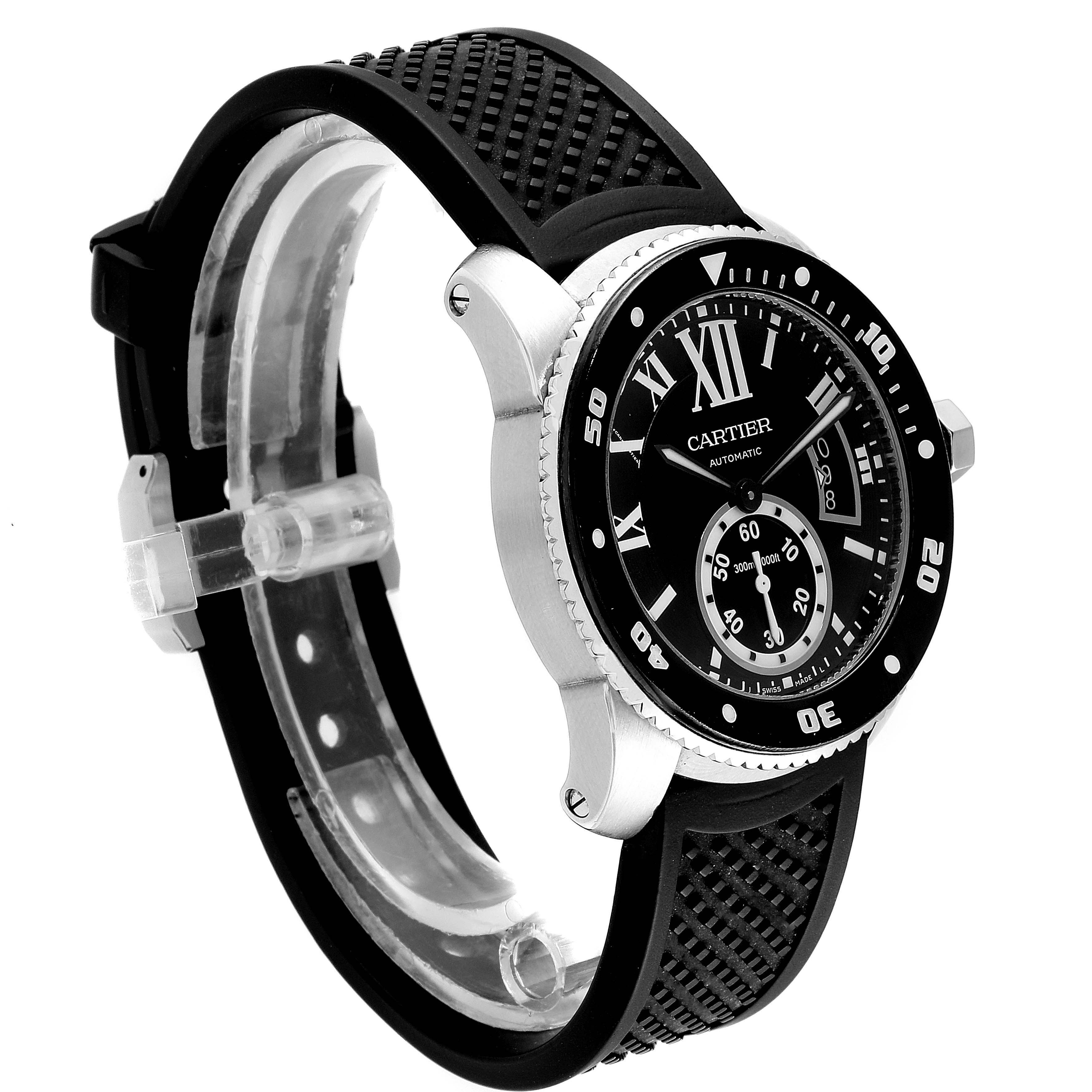 The Calibre de Cartier watch by Cartier is shown at a three-quarter angle, highlighting its black dial and rubber strap.