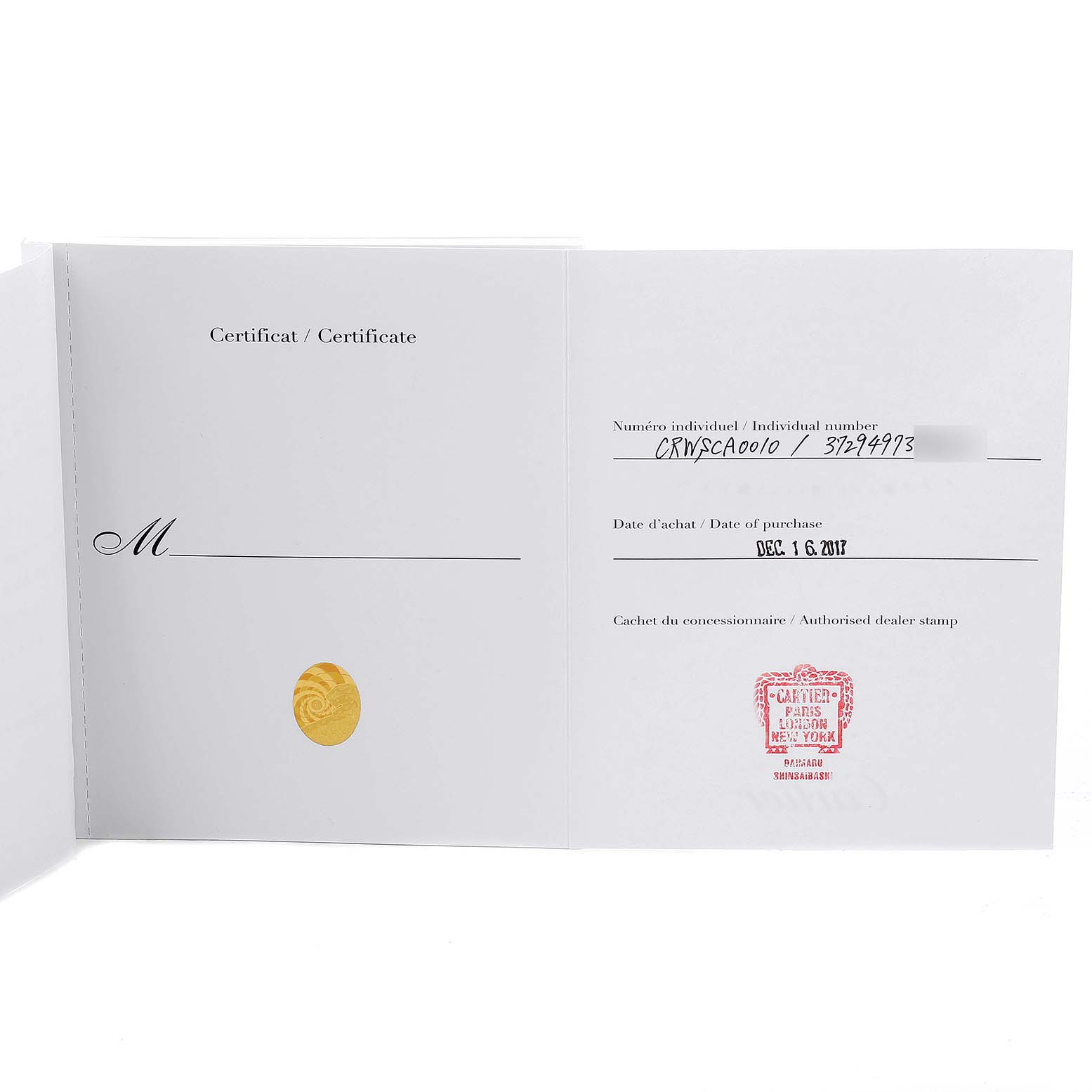 The image shows an open certificate of authenticity for the Calibre de Cartier watch by Cartier.
