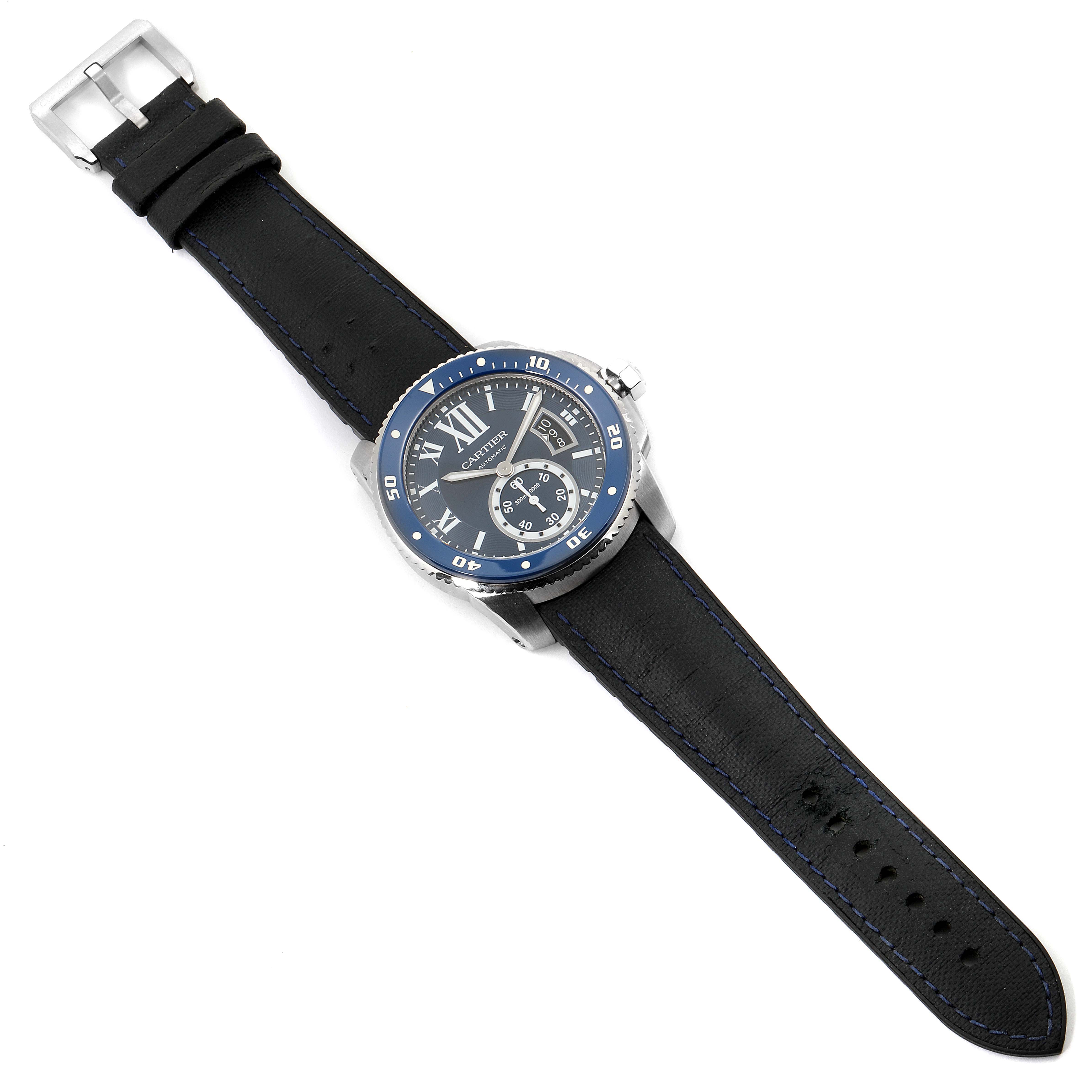 The image shows a full view of a Calibre de Cartier watch by Cartier, displaying the face, bezel, strap, and buckle.