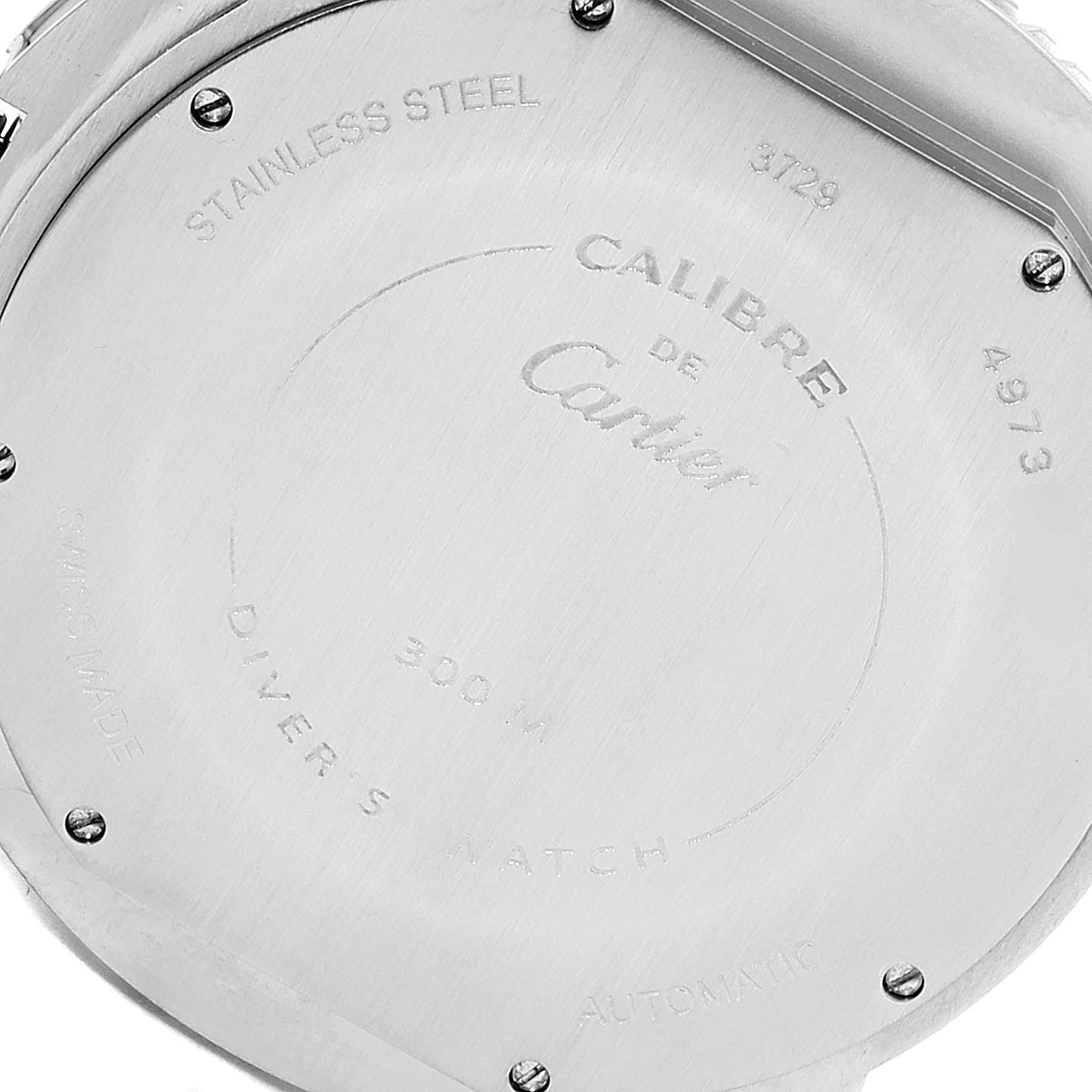 This image shows the case back of a Calibre de Cartier watch by Cartier, highlighting its engravings and screws.