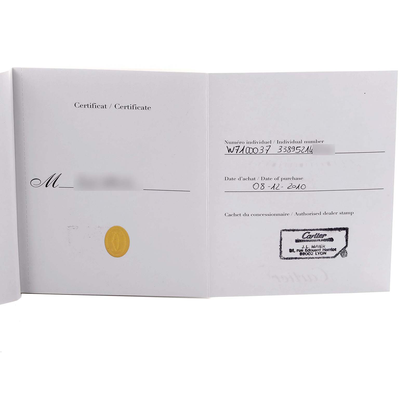 This image shows the certificate booklet for the Calibre de Cartier watch by Cartier, displaying purchase details and the dealer stamp.