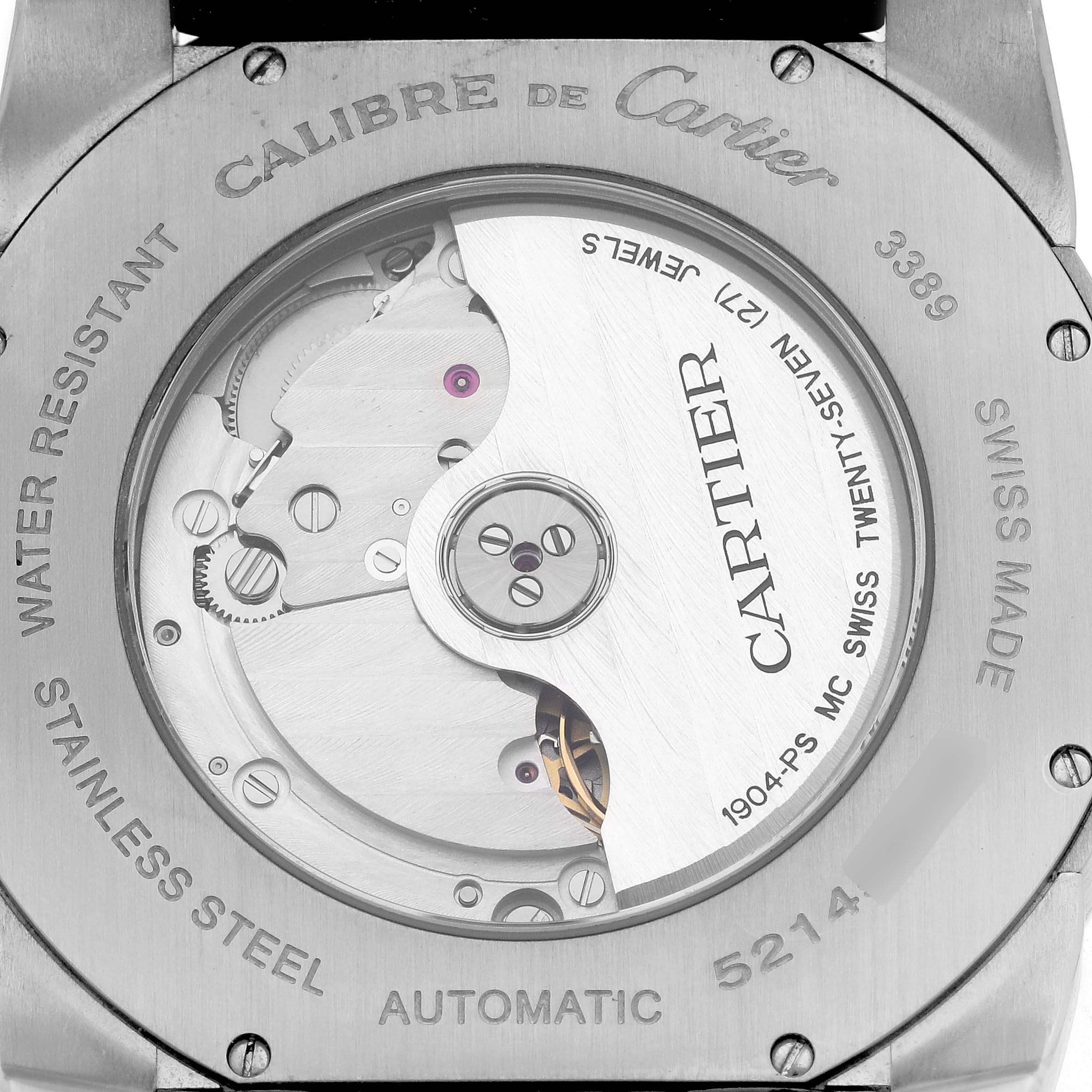 The image shows the back of a Calibre de Cartier watch, highlighting its automatic movement and inner mechanical parts.