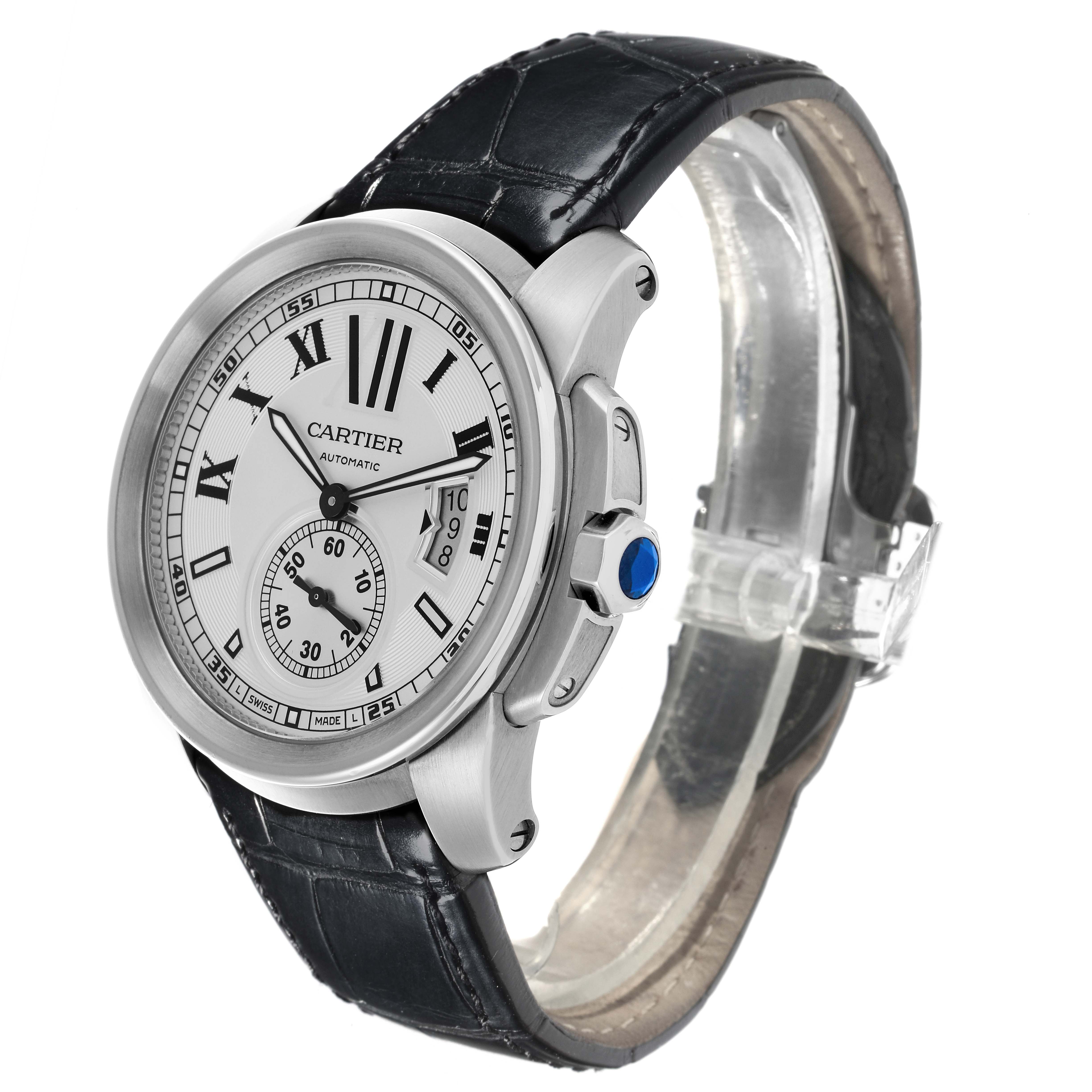 The Calibre de Cartier watch is shown at a slight angle, highlighting the face, bezel, crown, and leather strap.