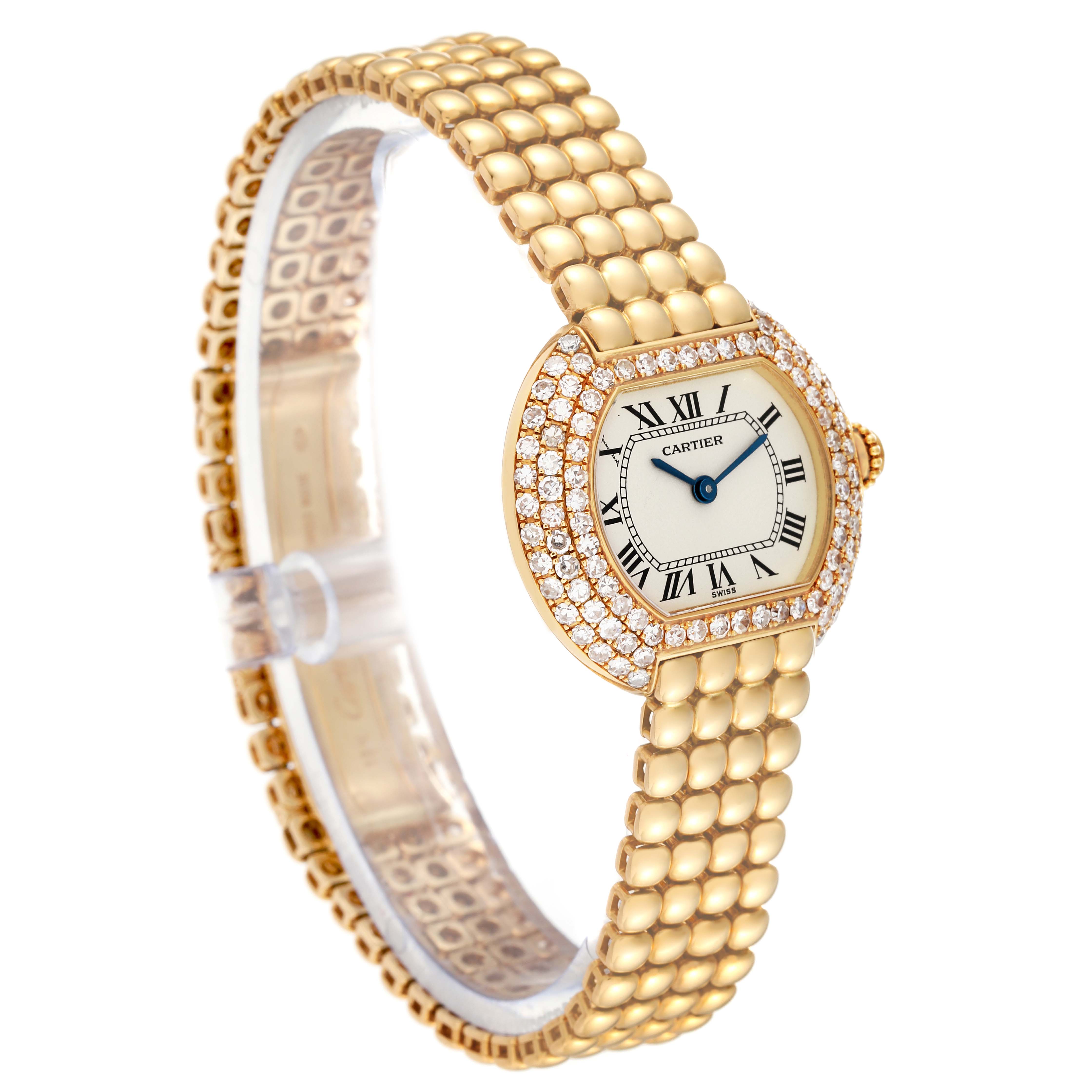 The image shows a Cartier Tortue Women's Yellow Gold Silver Dial Women's Yellow Gold Silver Dial watch at an angle highlighting its gold bracelet, diamond-encrusted bezel, and Roman numeral dial.