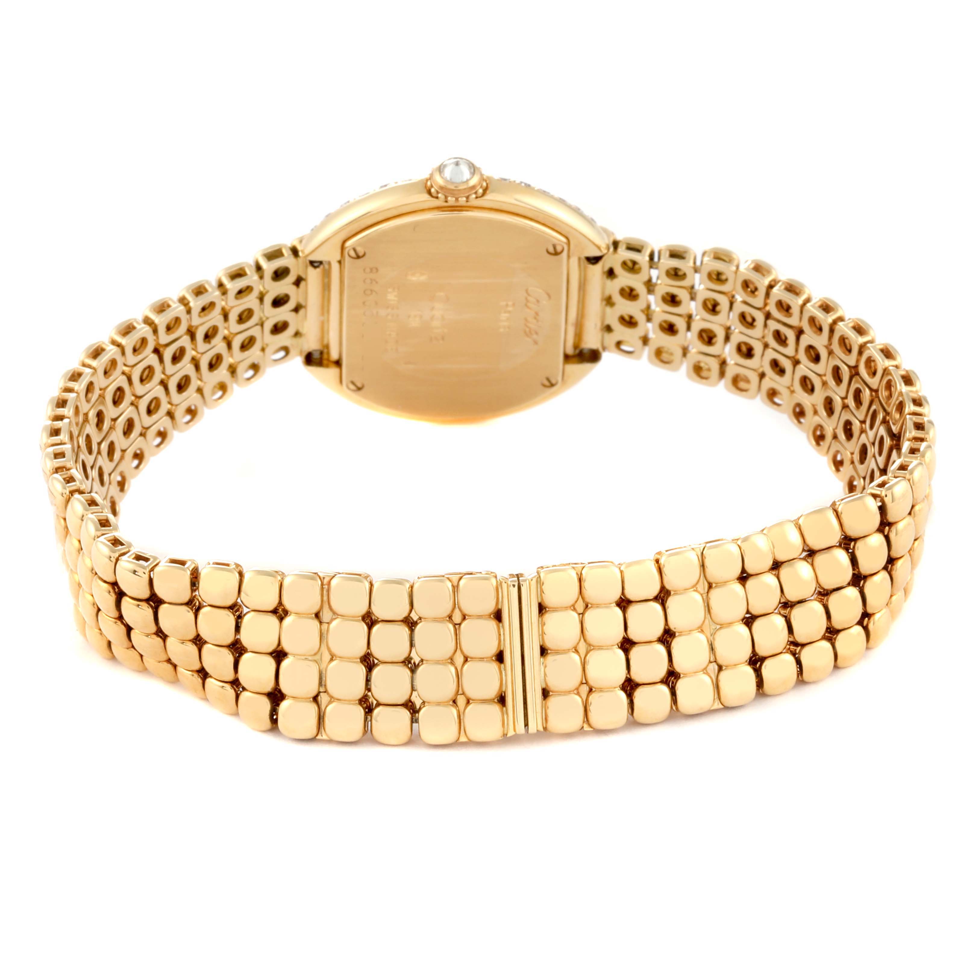 The image shows the back view of the Cartier Tortue Women's Yellow Gold Silver Dial Women's Yellow Gold Silver Dial watch, highlighting its gold bracelet and case back.