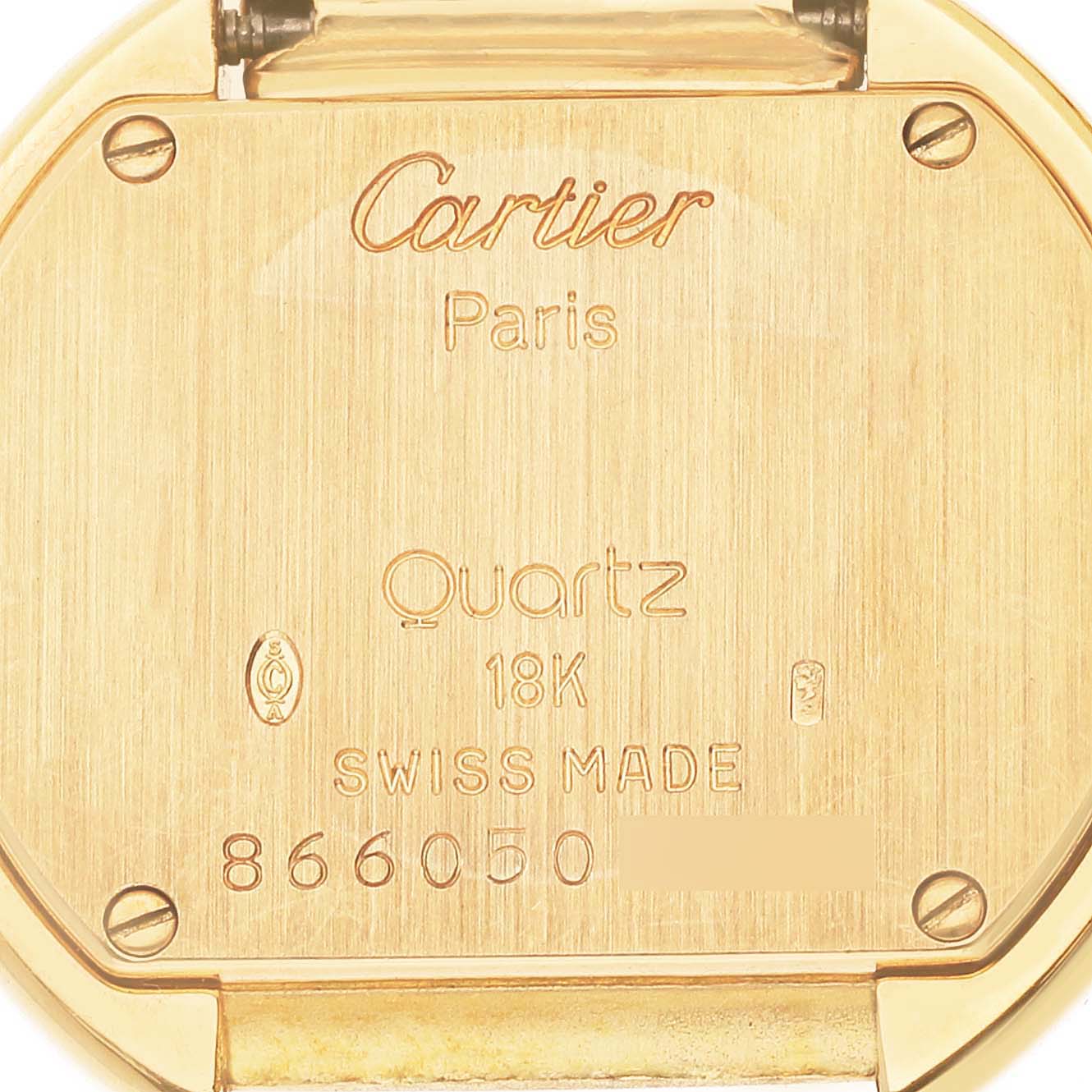 The image shows the back case of a Cartier Tortue Women's Yellow Gold Silver Dial Women's Yellow Gold Silver Dial watch, highlighting the model details and materials.