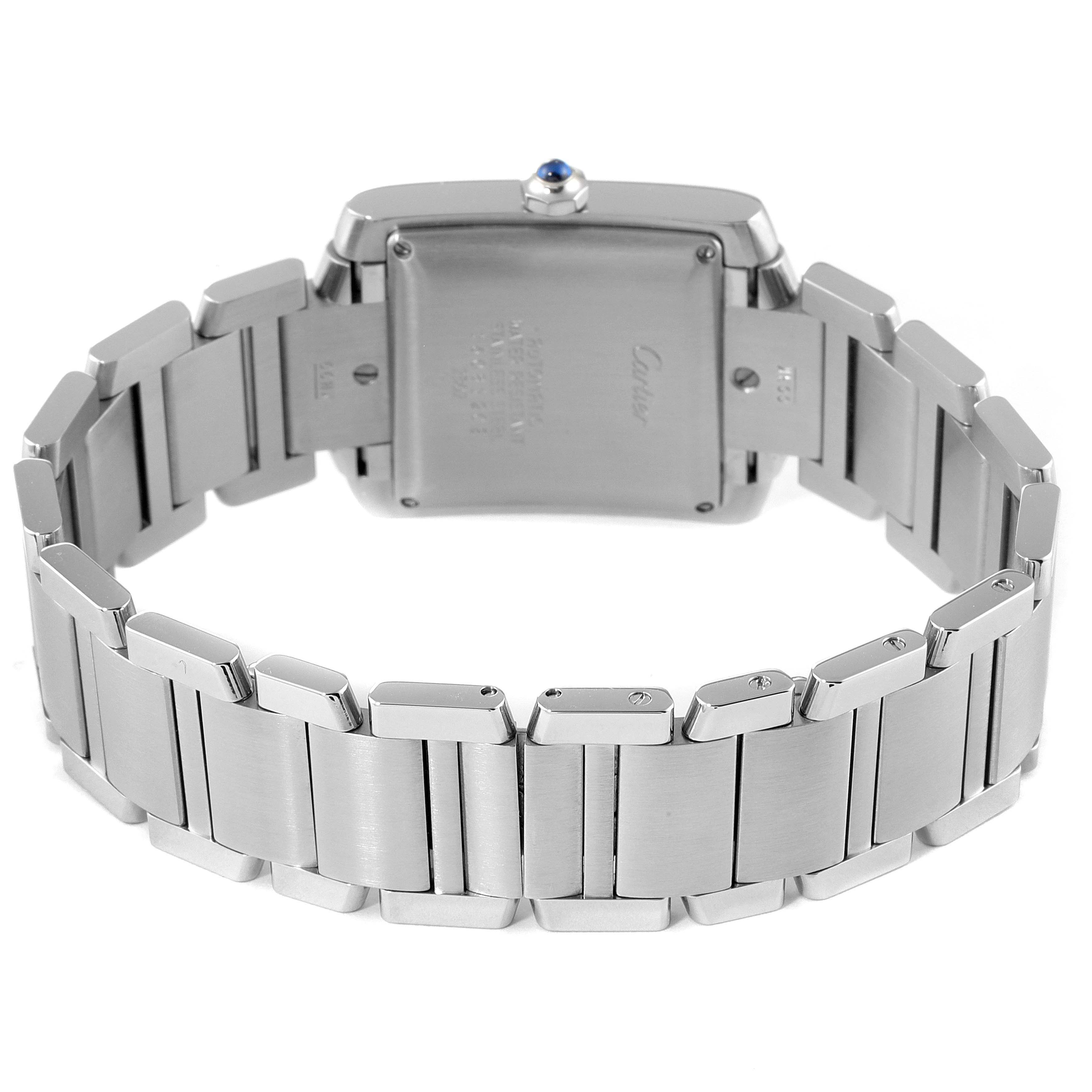 The image shows the back and bracelet of a Cartier Tank Française watch, highlighting the clasp and caseback.