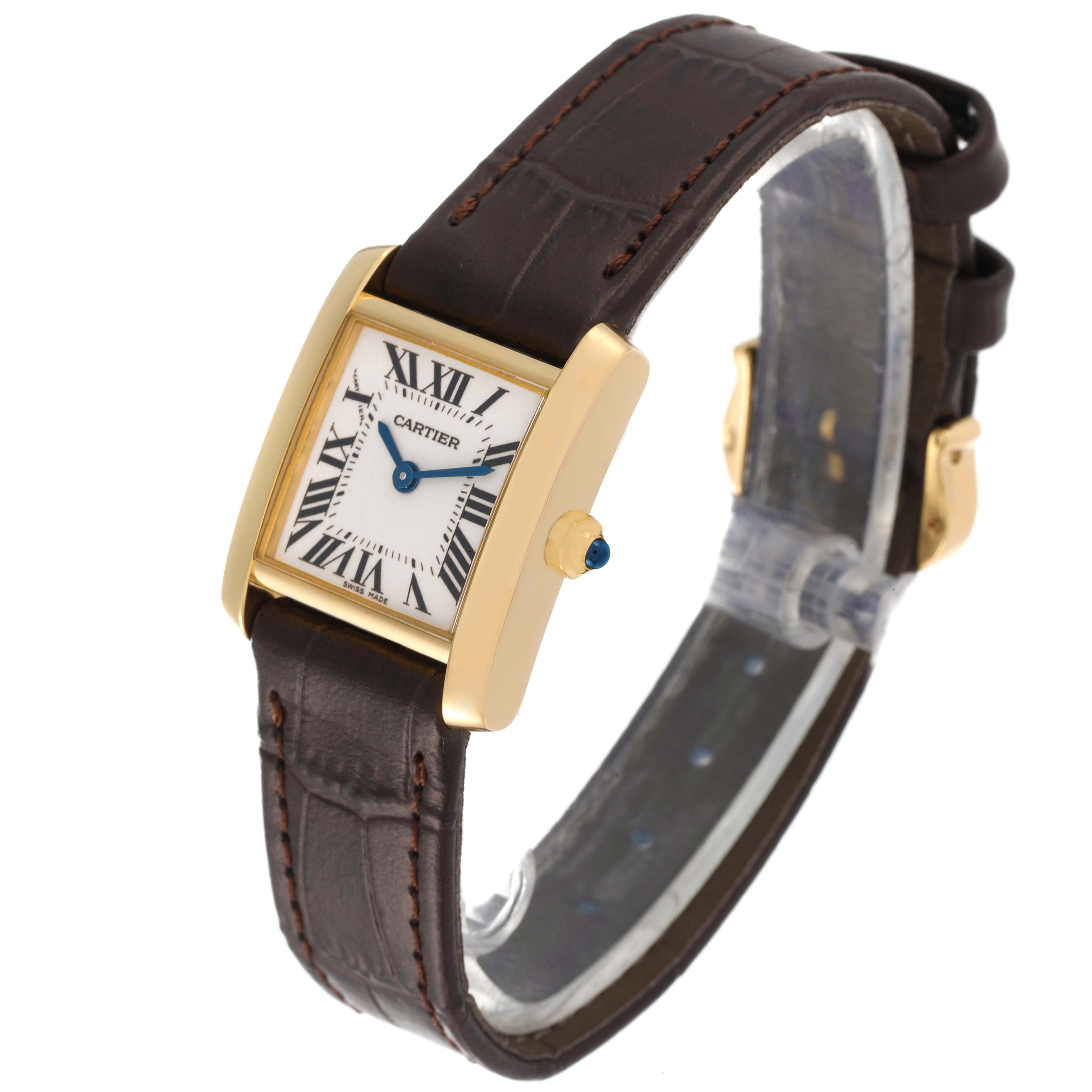 The image shows a Cartier Tank Francaise W5000256 Women's Yellow Gold Silver Dial W5000256 Women's Yellow Gold Silver Dial watch at an angled view, highlighting the face, leather strap, and gold casing.
