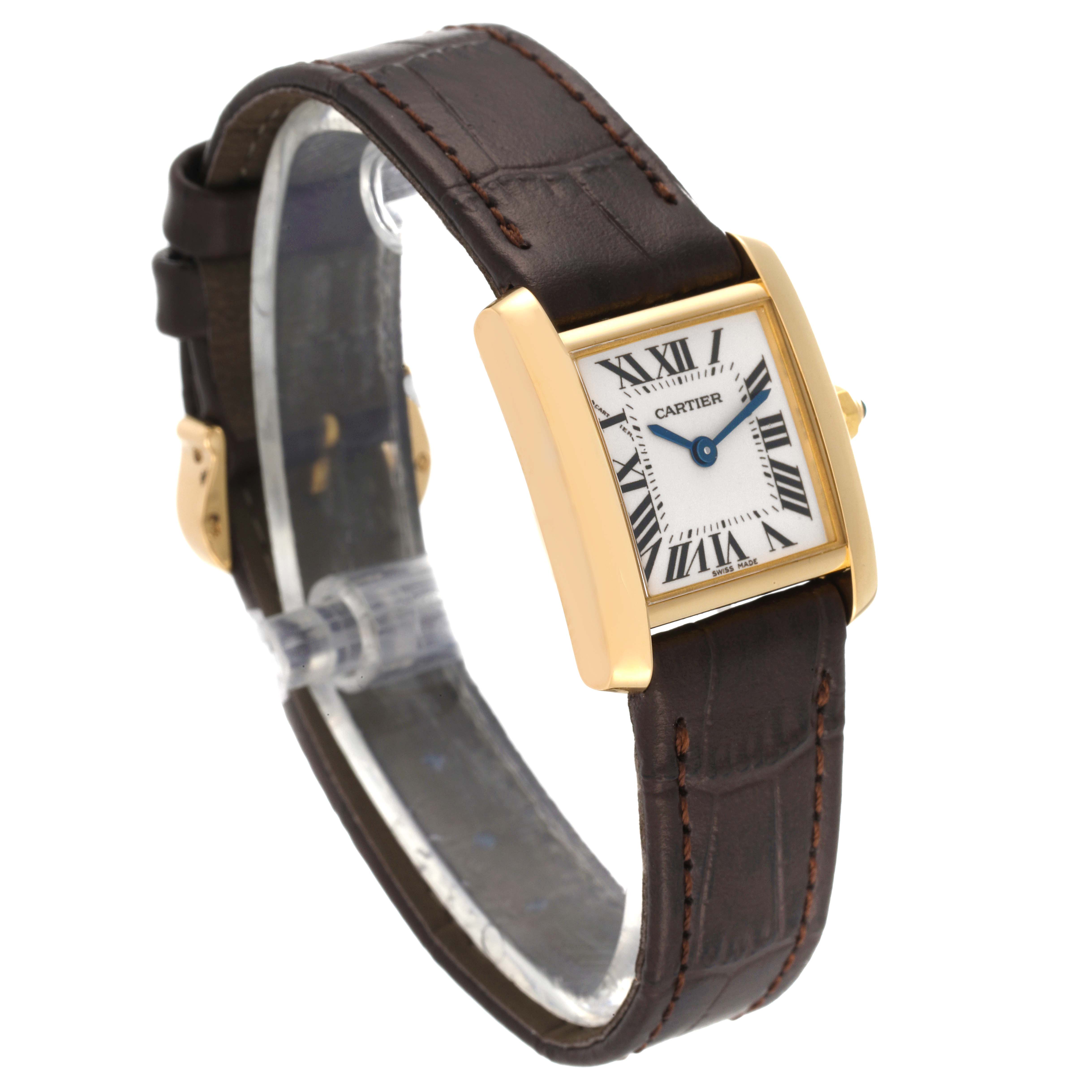 The image shows a Cartier Tank Française watch at a slight angle, displaying its face, gold case, and brown leather strap.