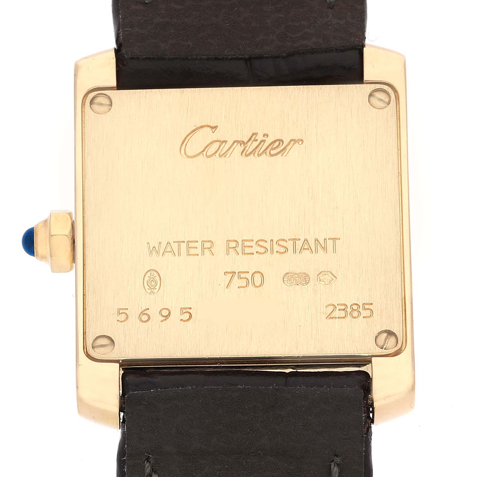 The image shows the backside of a Cartier Tank Francaise W5000256 Women's Yellow Gold Silver Dial W5000256 Women's Yellow Gold Silver Dial watch, displaying inscriptions and part of the leather strap.