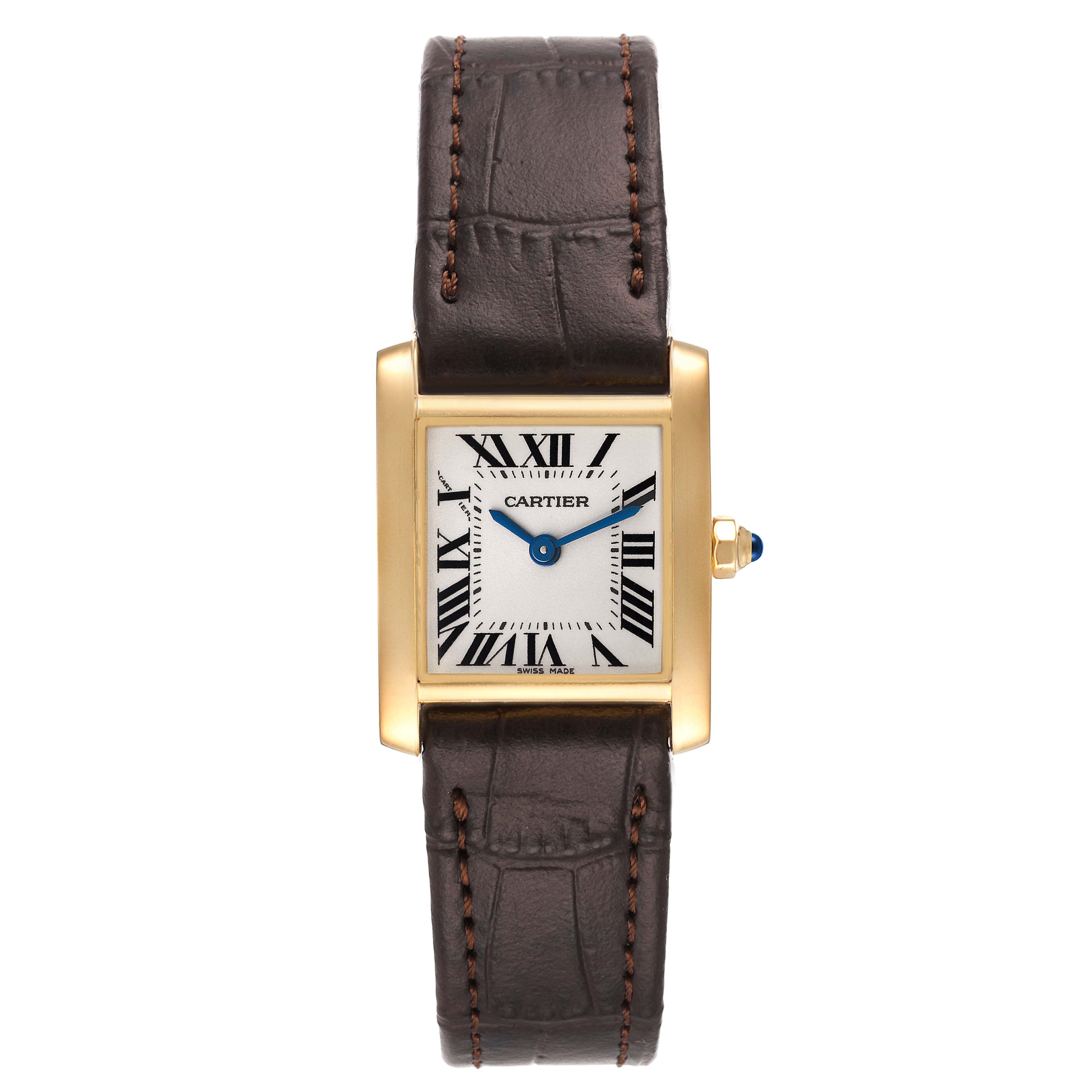 The image shows a frontal view of a Cartier Tank Francaise W5000256 Women's Yellow Gold Silver Dial W5000256 Women's Yellow Gold Silver Dial watch with a gold case, white dial, Roman numerals, and a brown leather strap.