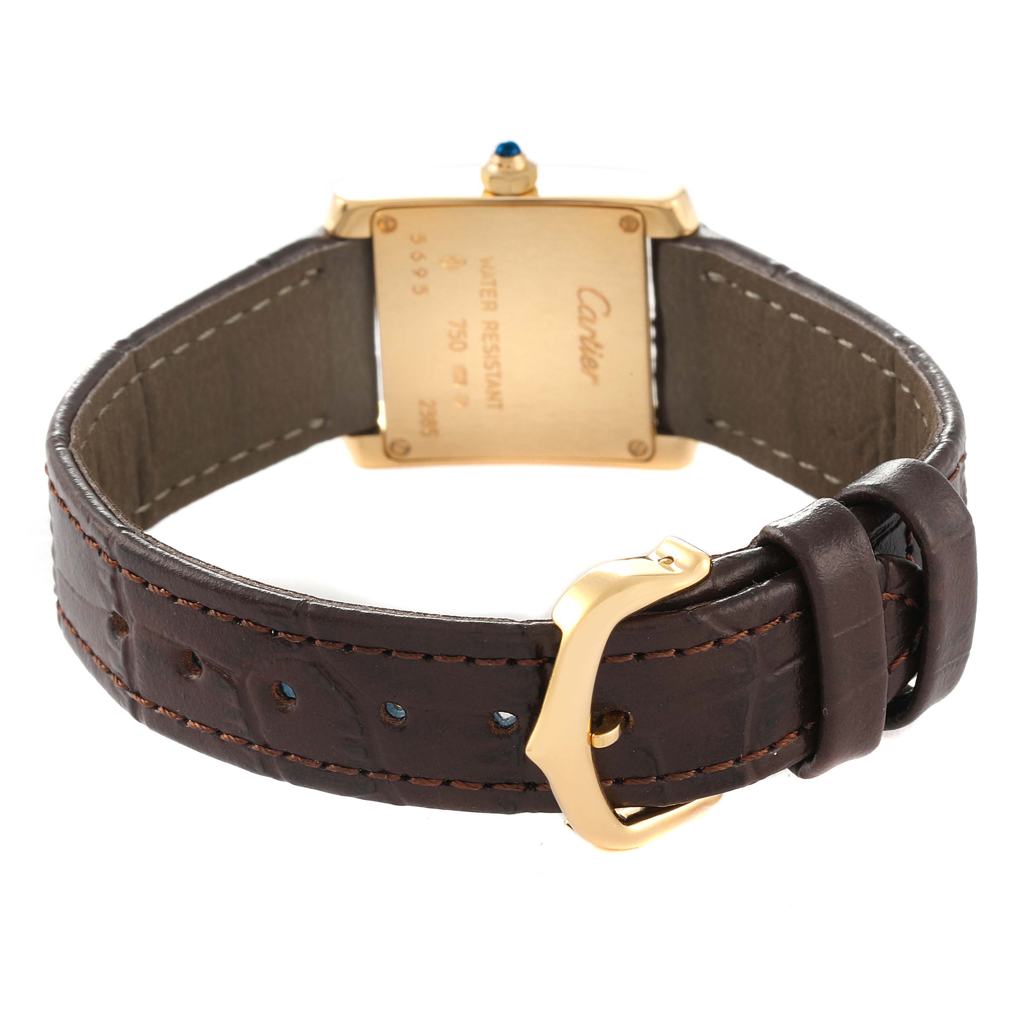 This image shows the back of the Cartier Tank Francaise W5000256 Women's Yellow Gold Silver Dial W5000256 Women's Yellow Gold Silver Dial watch, highlighting the case back, crown, and leather strap with a buckle.