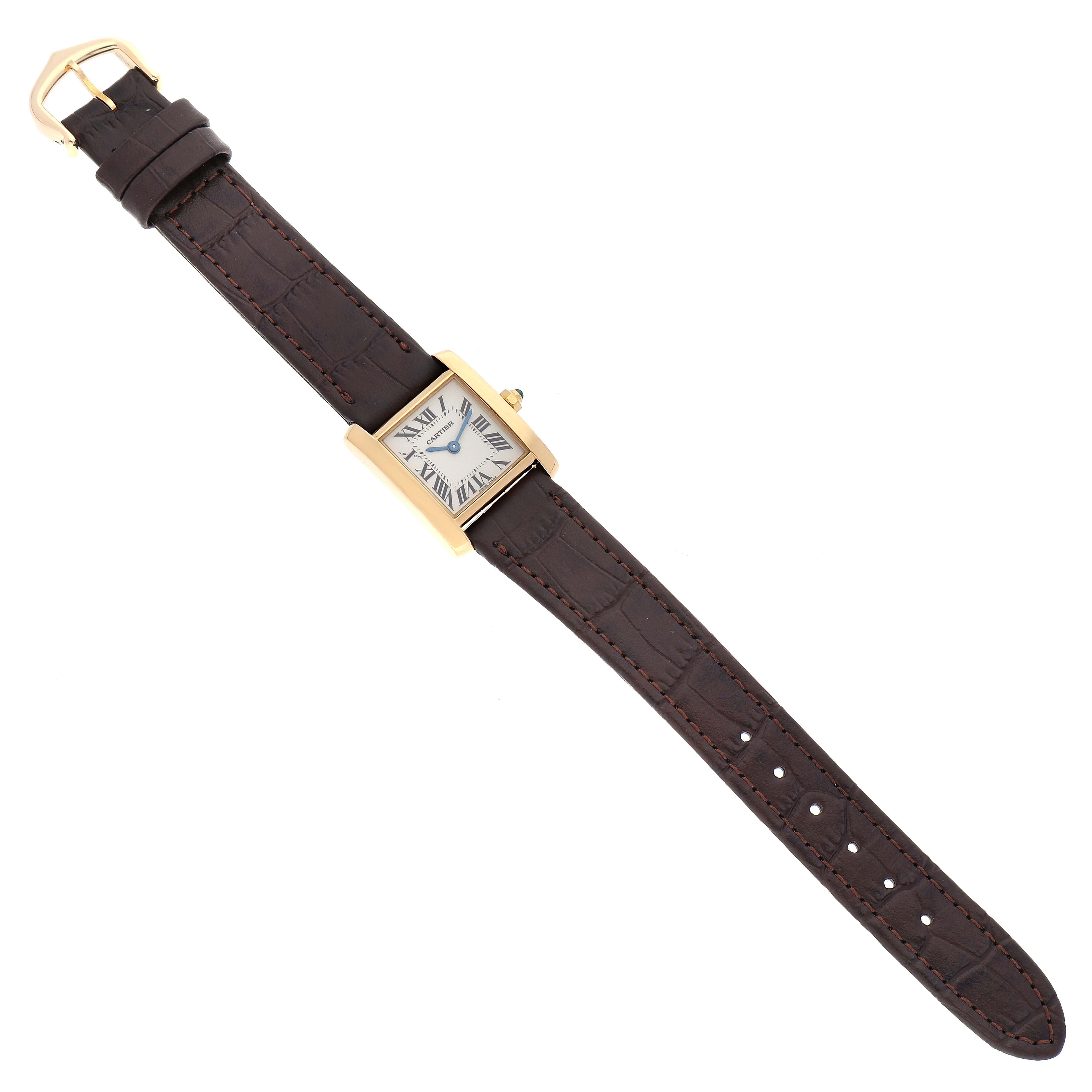 The Cartier Tank Francaise W5000256 Women's Yellow Gold Silver Dial W5000256 Women's Yellow Gold Silver Dial watch is shown from a top-down angle, featuring its leather strap and gold rectangular case with Roman numerals.