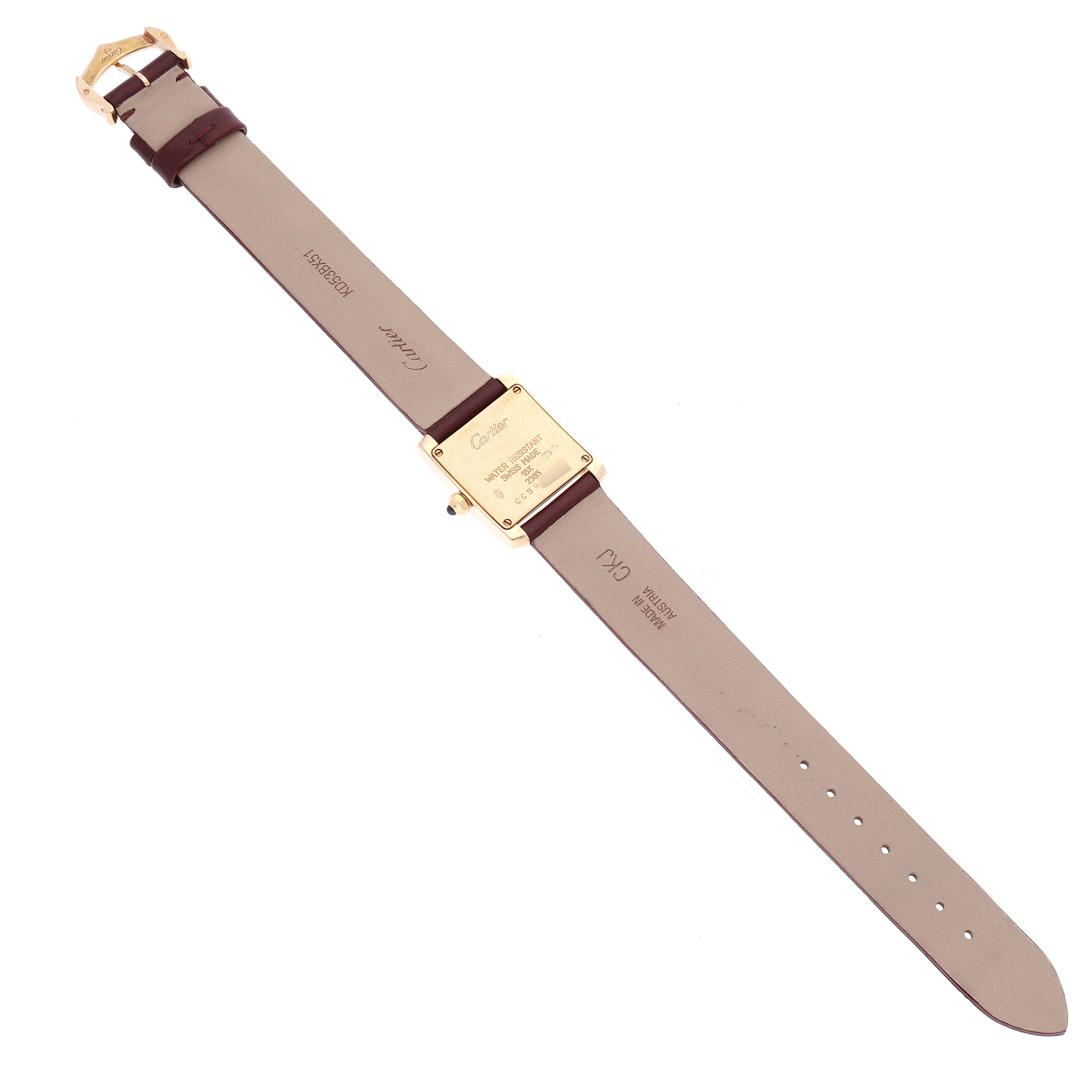 This image shows the back side of a Cartier Tank Francaise W5000256 Women's Yellow Gold Silver Dial W5000256 Women's Yellow Gold Silver Dial watch, displaying the case back, straps, and buckle.