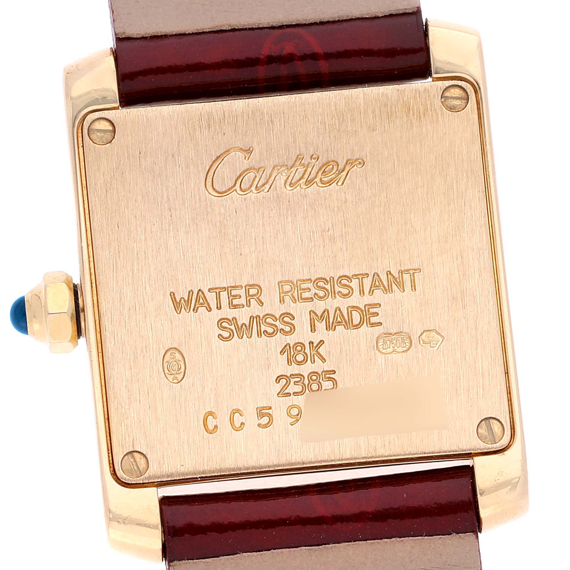 The image shows the back case of a Cartier Tank Francaise W5000256 Women's Yellow Gold Silver Dial W5000256 Women's Yellow Gold Silver Dial watch with inscriptions and part of the leather strap visible.