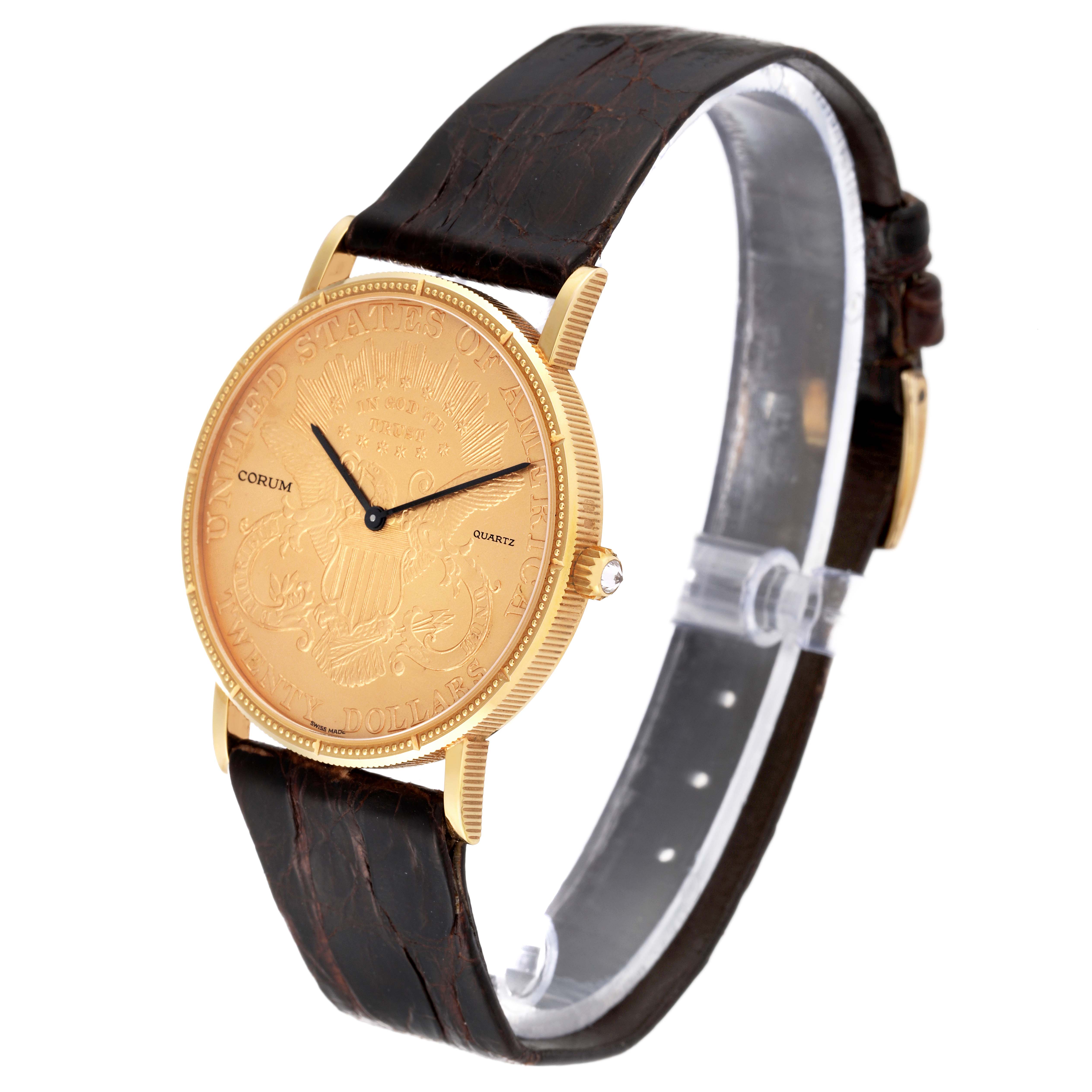 The Corum Coin Watch 4414556 Men's Yellow Gold Champagne Dial 4414556 Men's Yellow Gold Champagne Dial model is shown at a slight side angle, highlighting its engraved gold dial and brown leather strap.